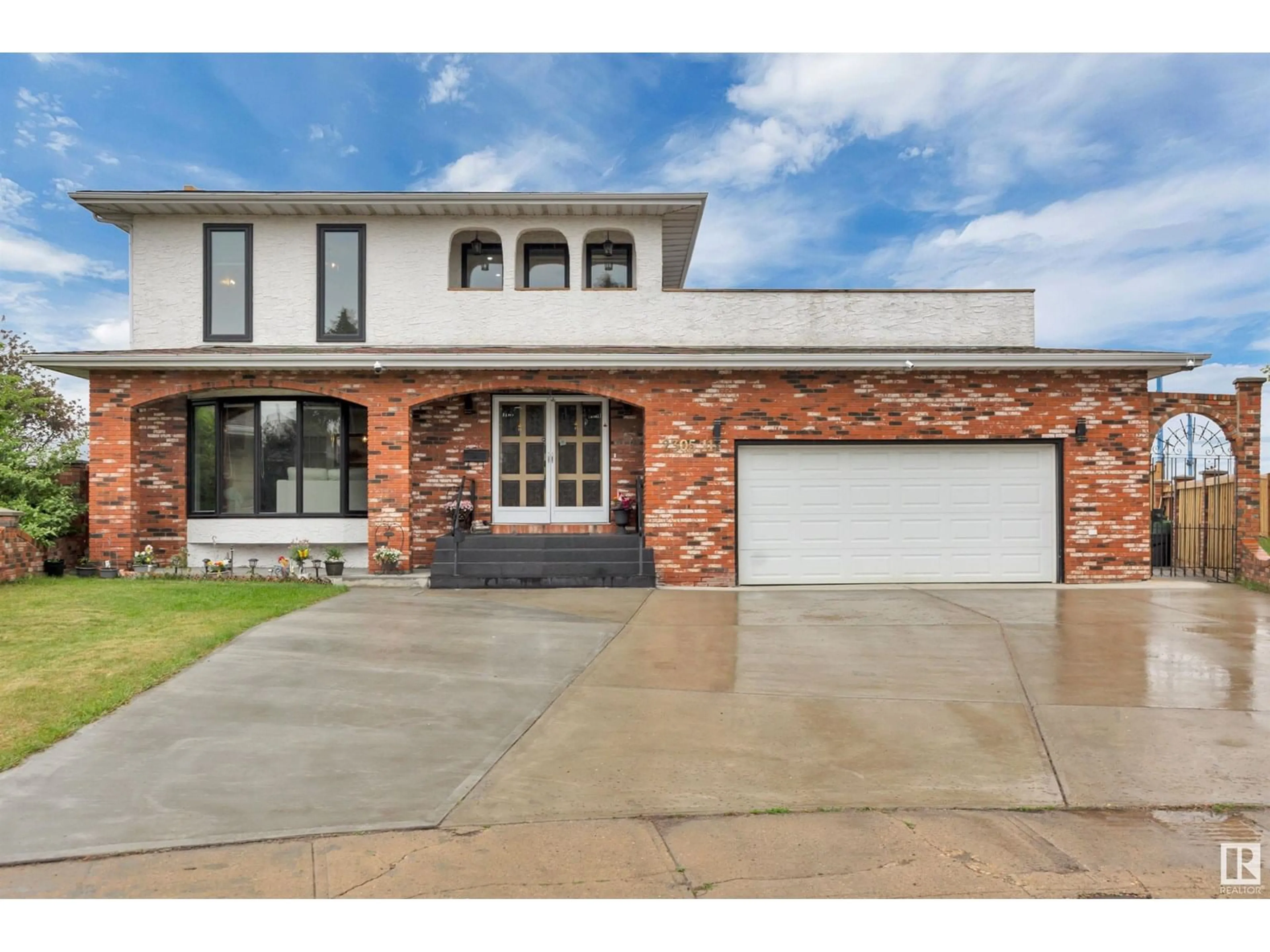 Home with brick exterior material, street for NW - 2305 111A ST, Edmonton Alberta T6J4P1