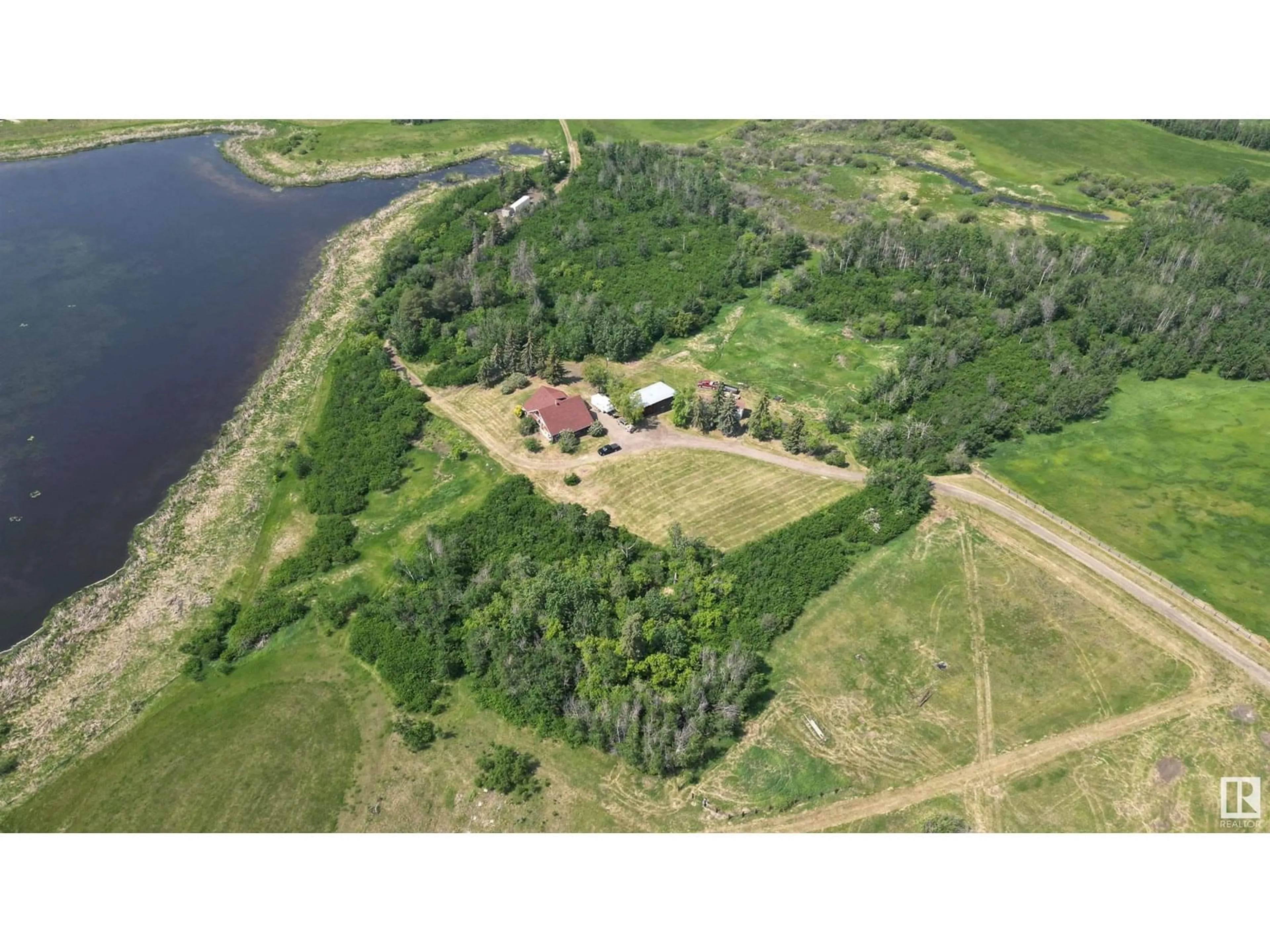 A pic from outside/outdoor area/front of a property/back of a property/a pic from drone, water/lake/river/ocean view for 57320 RGE ROAD 75, Rural Lac Ste. Anne County Alberta T0E1Y0