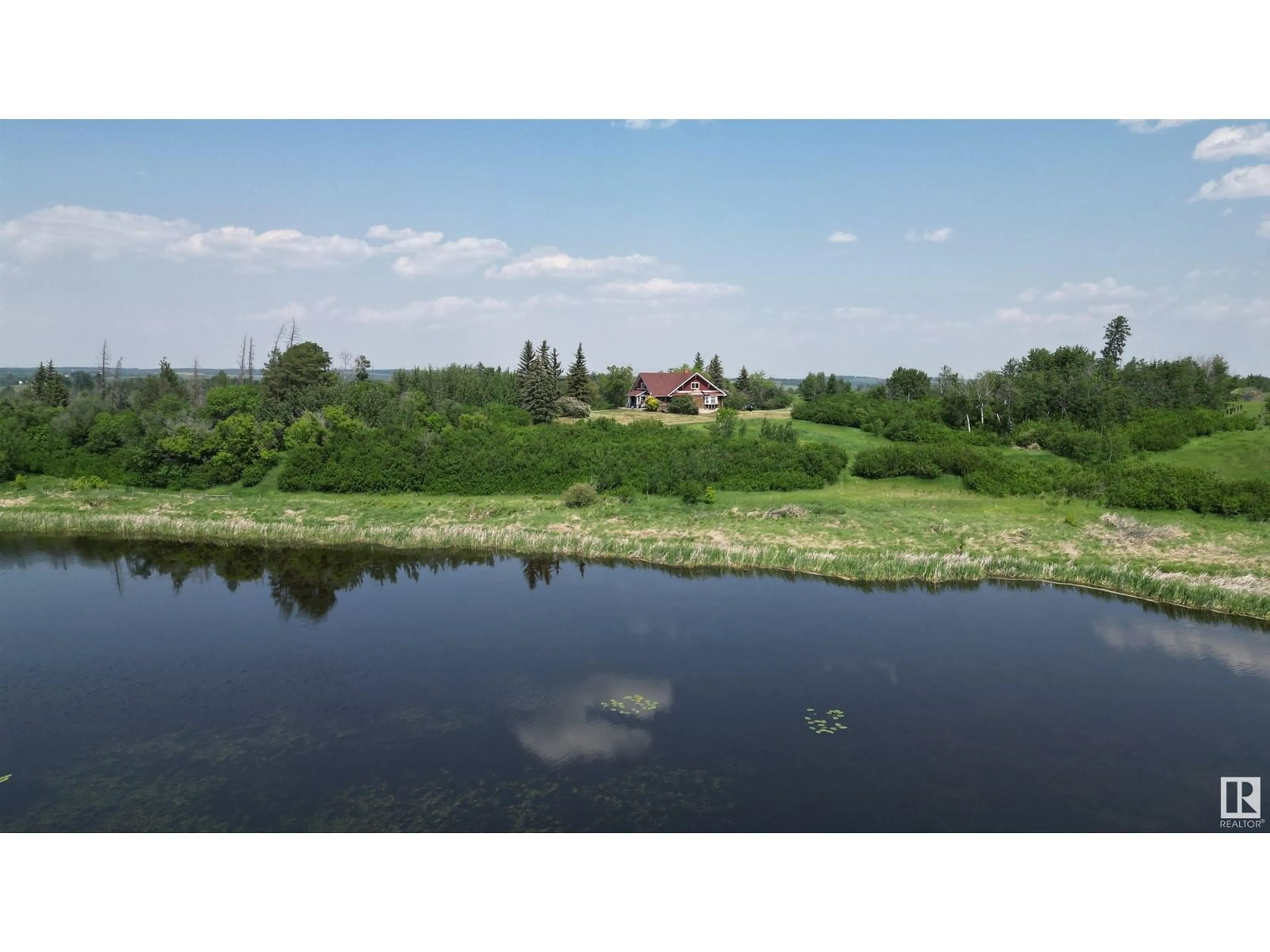 A pic from outside/outdoor area/front of a property/back of a property/a pic from drone, water/lake/river/ocean view for 57320 RGE ROAD 75, Rural Lac Ste. Anne County Alberta T0E1Y0