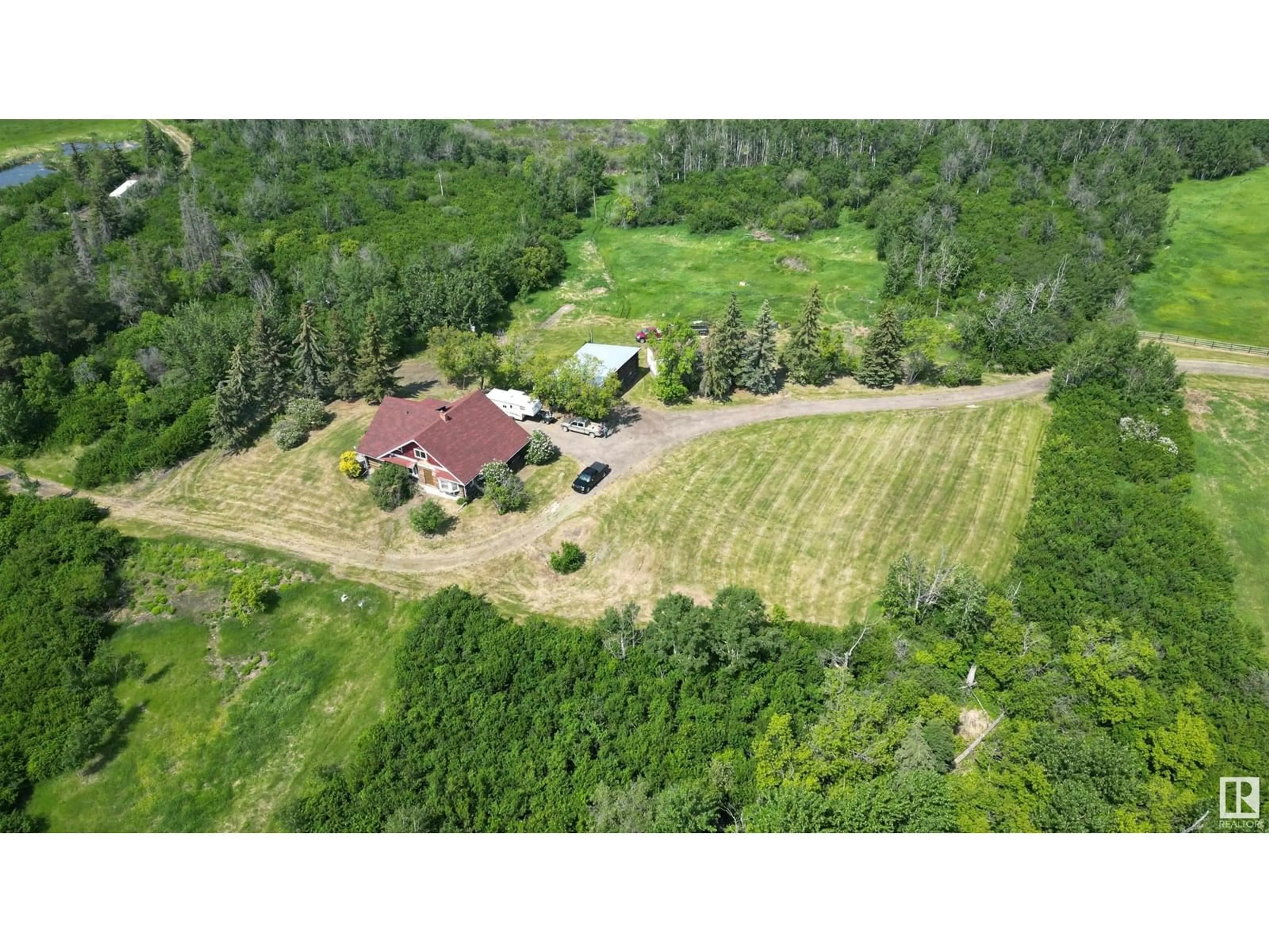 A pic from outside/outdoor area/front of a property/back of a property/a pic from drone, unknown for 57320 RGE ROAD 75, Rural Lac Ste. Anne County Alberta T0E1Y0