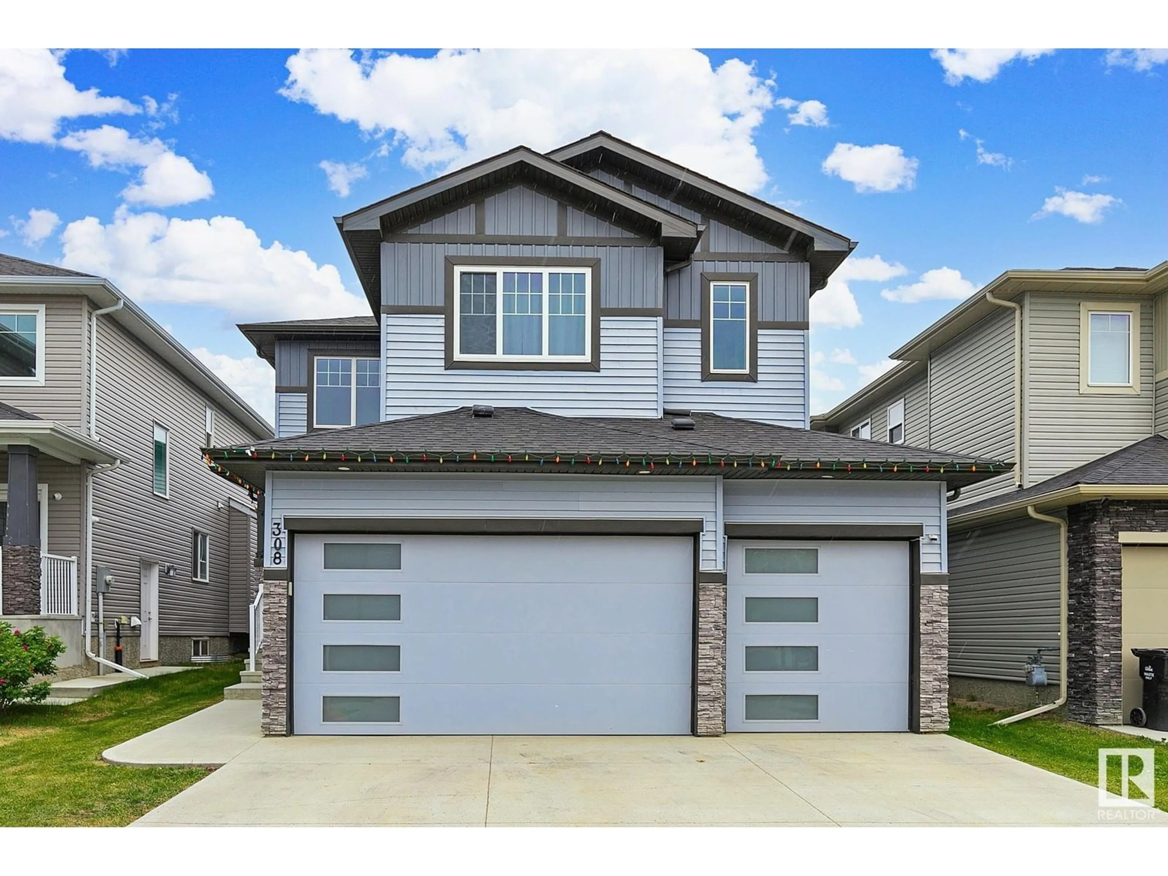 Home with vinyl exterior material, street for 308 HAVEN DR, Leduc Alberta T9E1B6