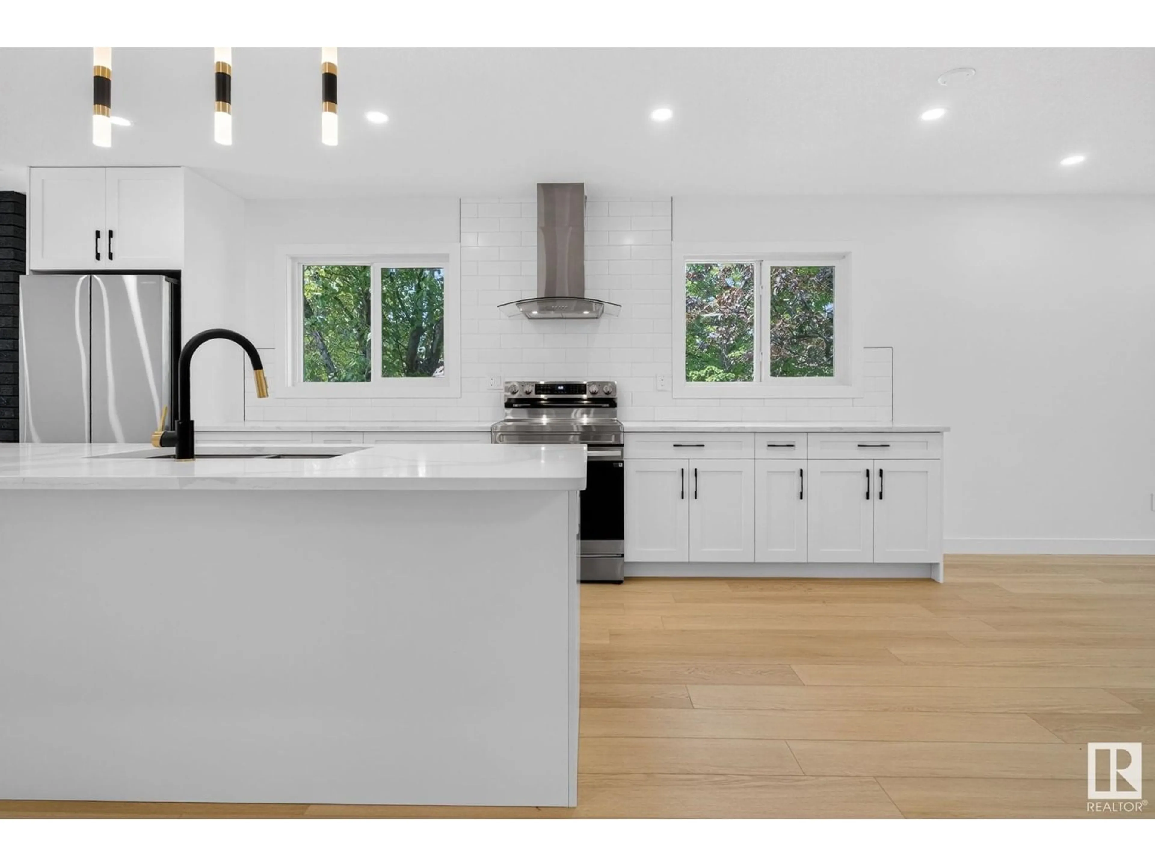 Open concept kitchen, wood/laminate floor for 1 COACHMAN PL, Sherwood Park Alberta T8H1C1