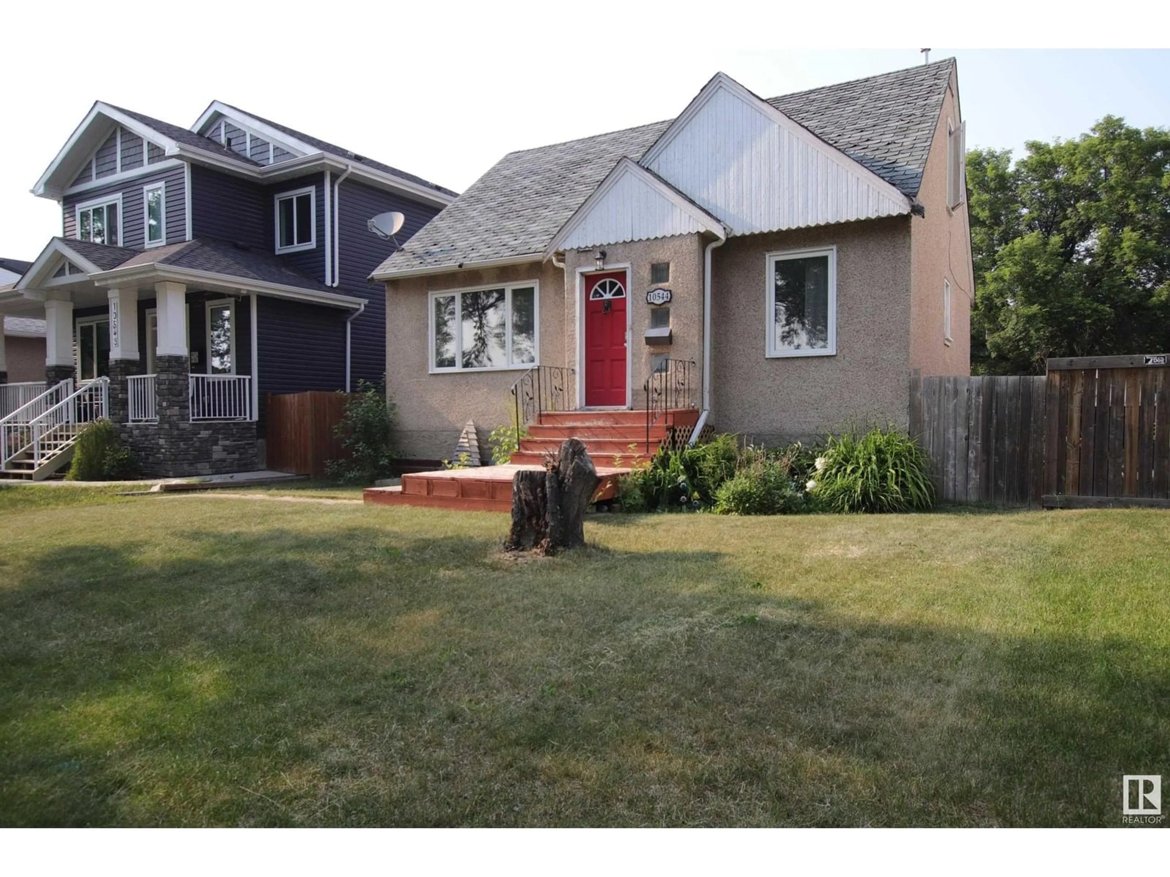 Home with vinyl exterior material, street for 10544 66 AV, Edmonton Alberta T6H1X4