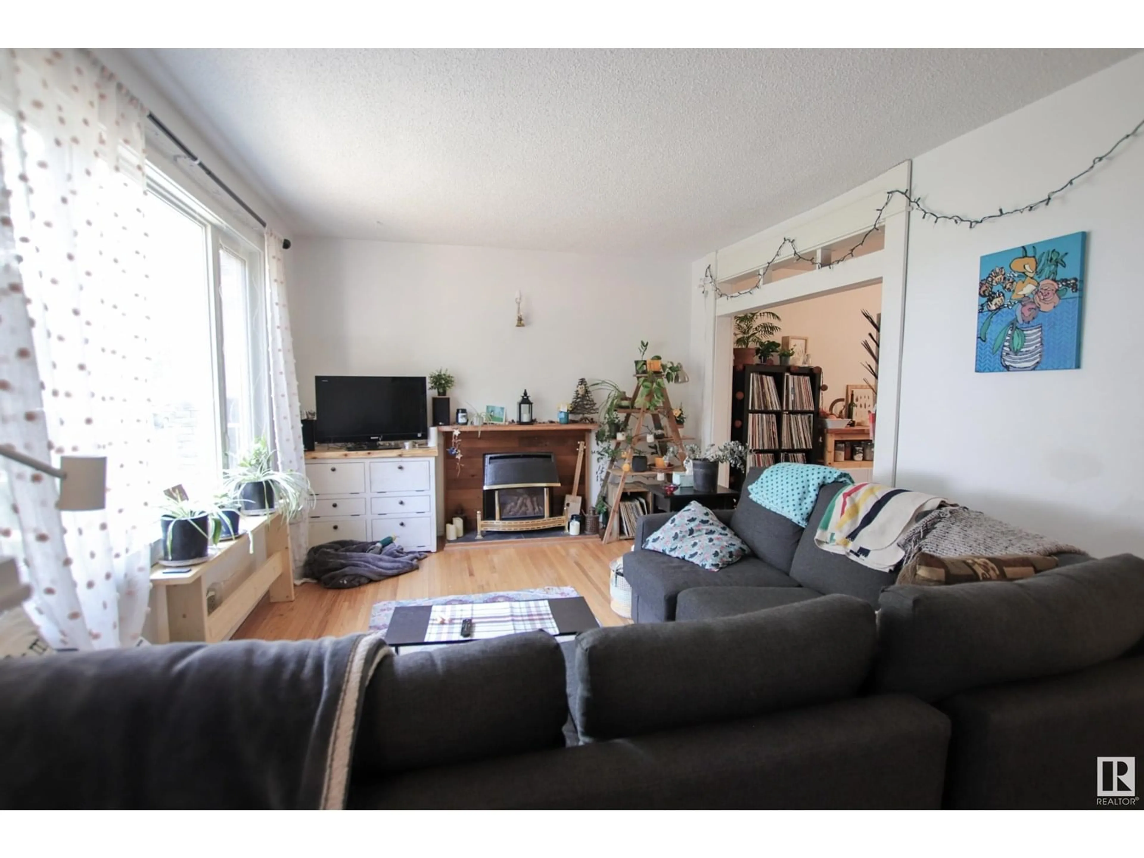 Living room with furniture, unknown for 10544 66 AV, Edmonton Alberta T6H1X4