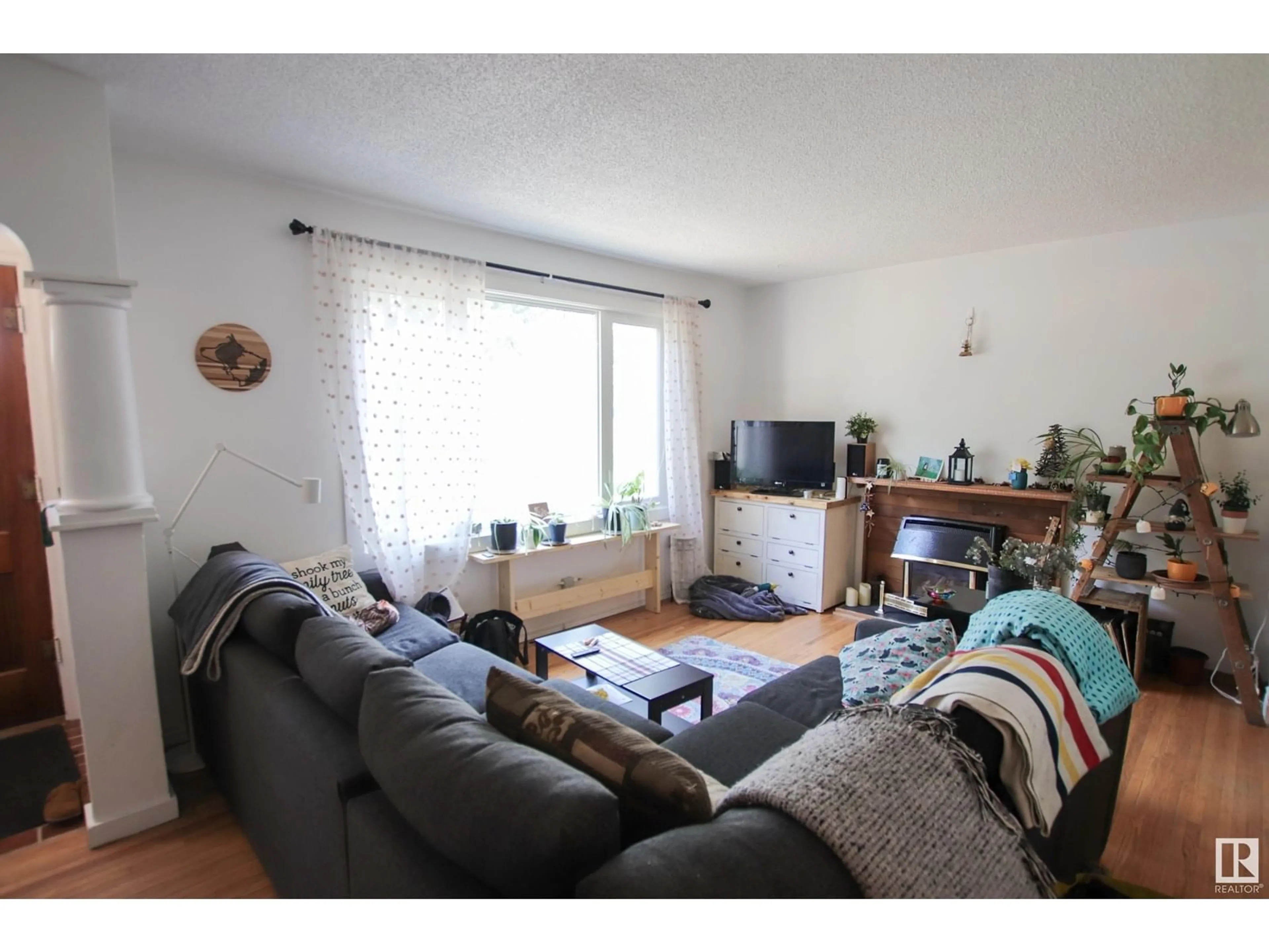 Living room with furniture, unknown for 10544 66 AV, Edmonton Alberta T6H1X4