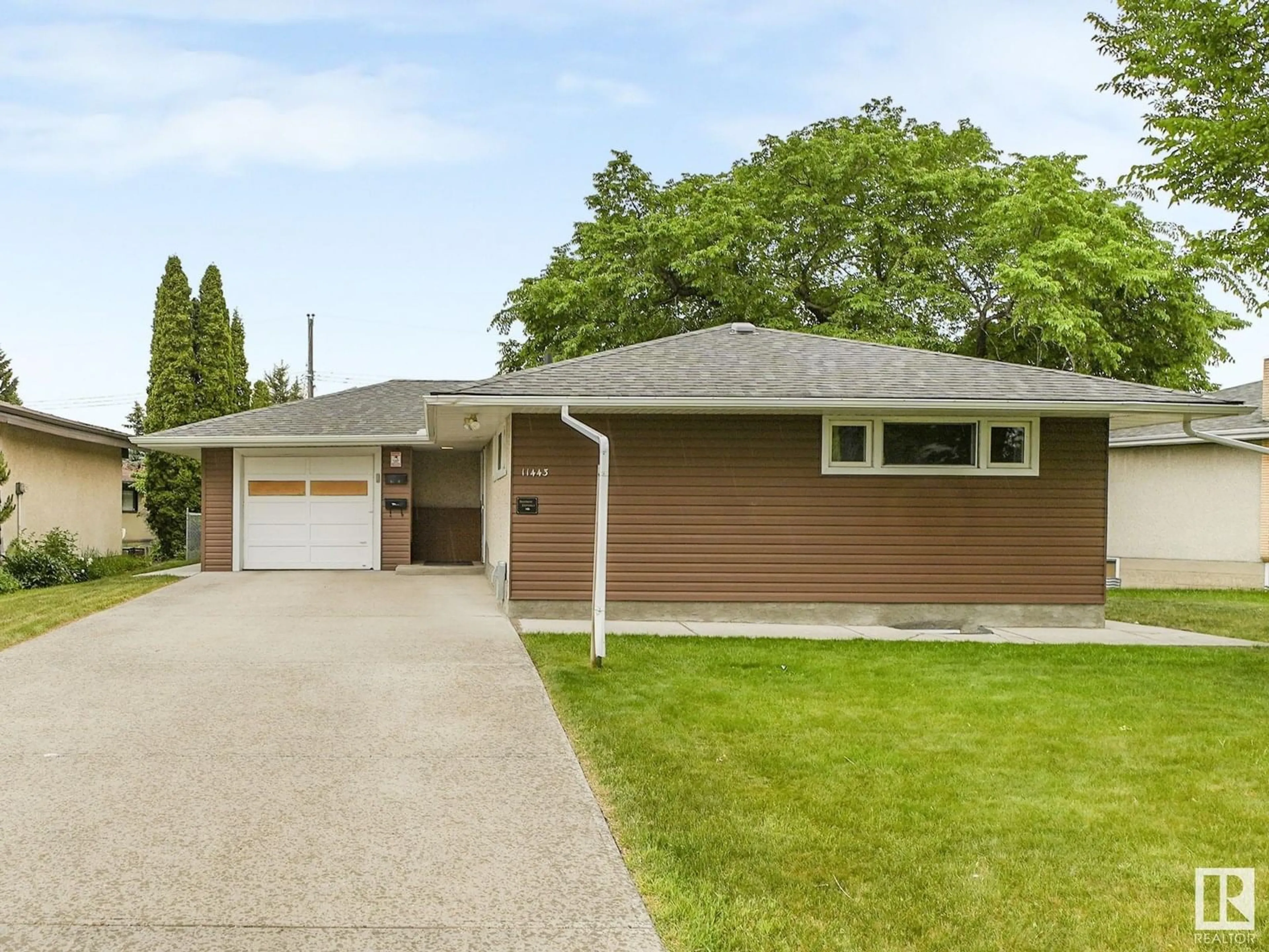 Home with vinyl exterior material, street for 11443 105 ST, Edmonton Alberta T5G2M9