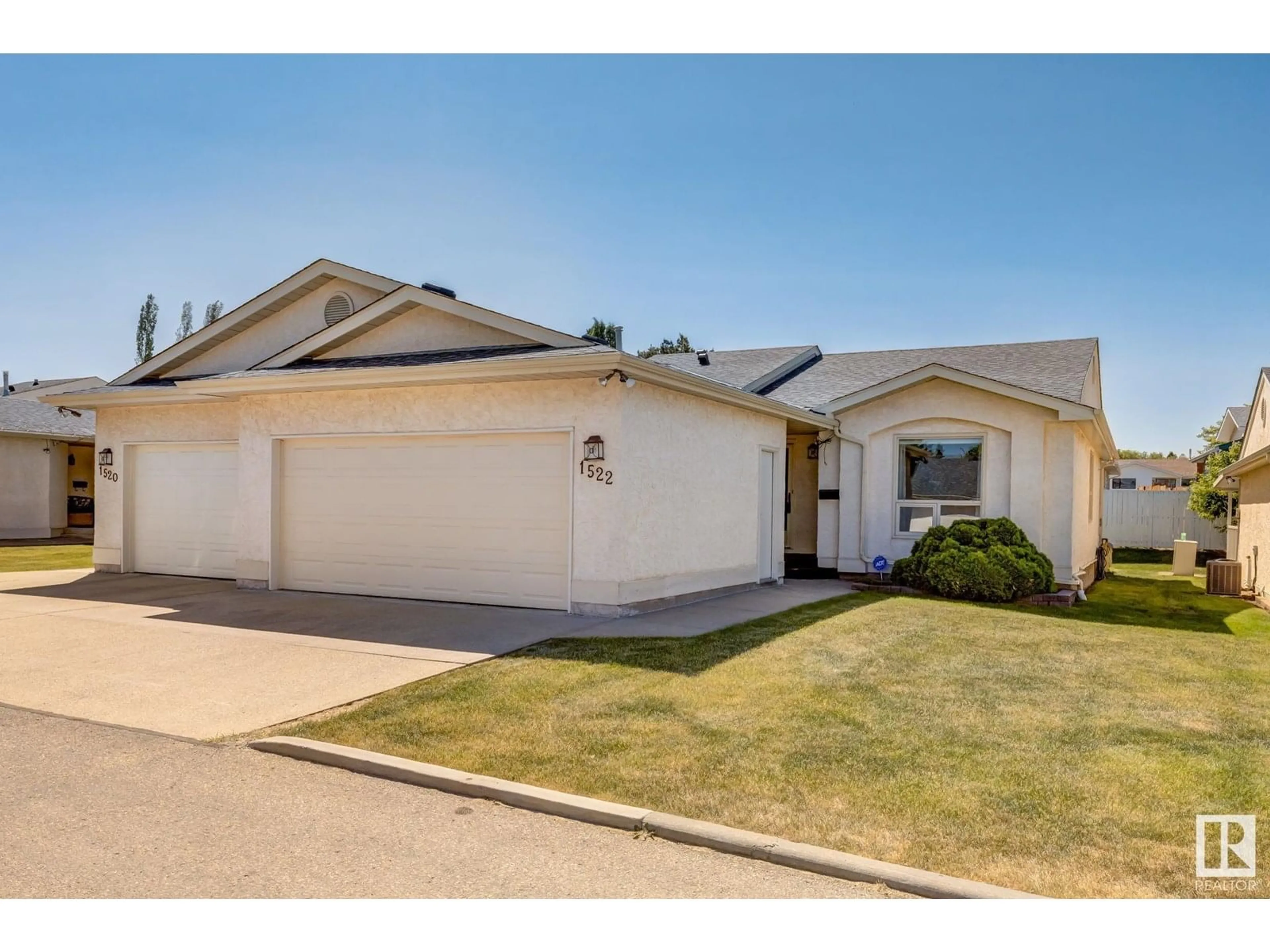 Home with vinyl exterior material, street for 1522 54 ST, Edmonton Alberta T6L6H4