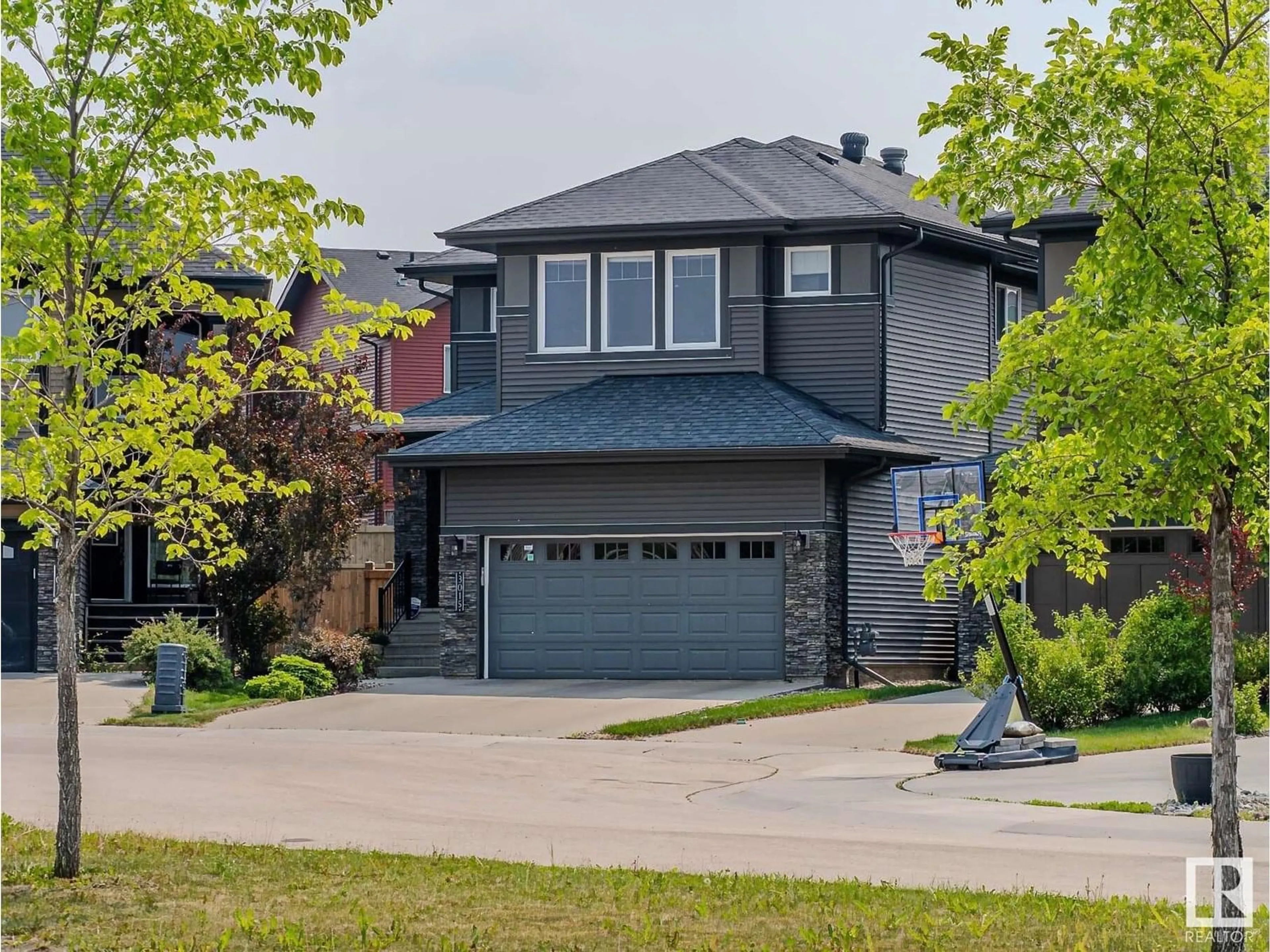 Home with vinyl exterior material, street for SW - 3015 WINSPEAR CM, Edmonton Alberta T6X1P4