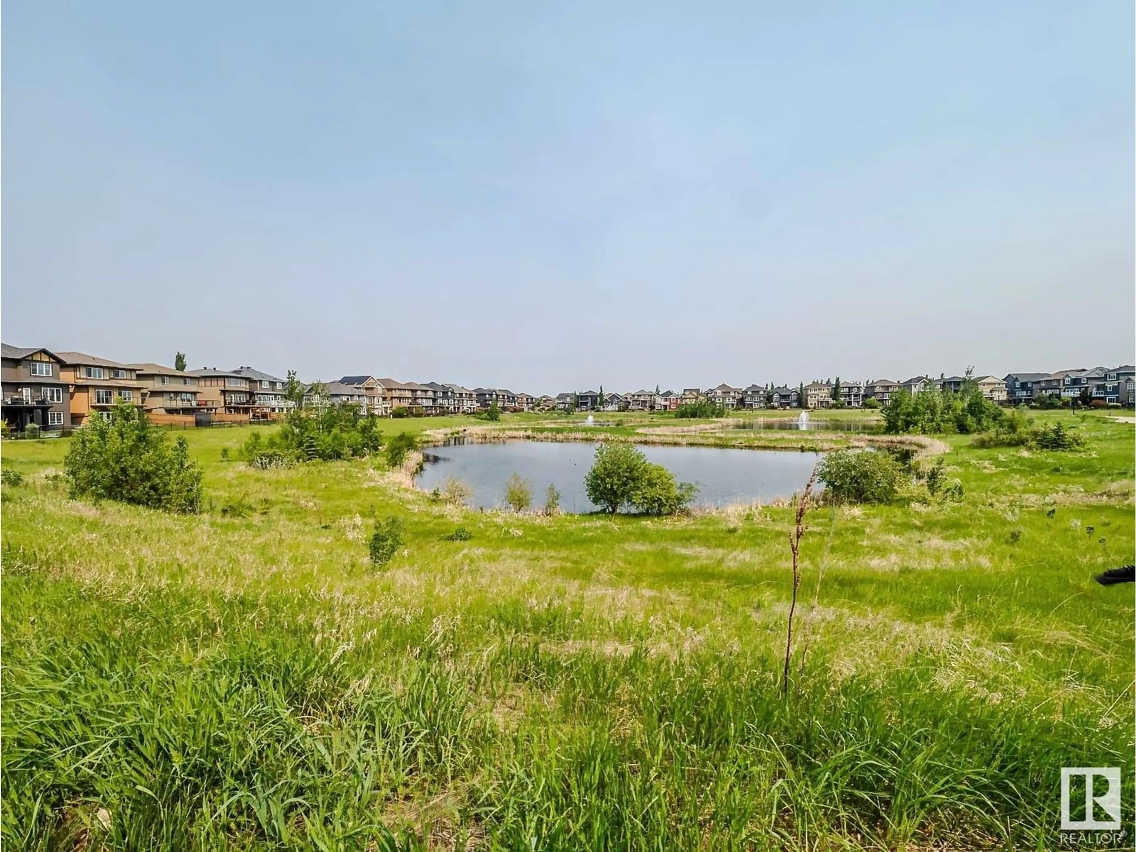A pic from outside/outdoor area/front of a property/back of a property/a pic from drone, water/lake/river/ocean view for SW - 3015 WINSPEAR CM, Edmonton Alberta T6X1P4
