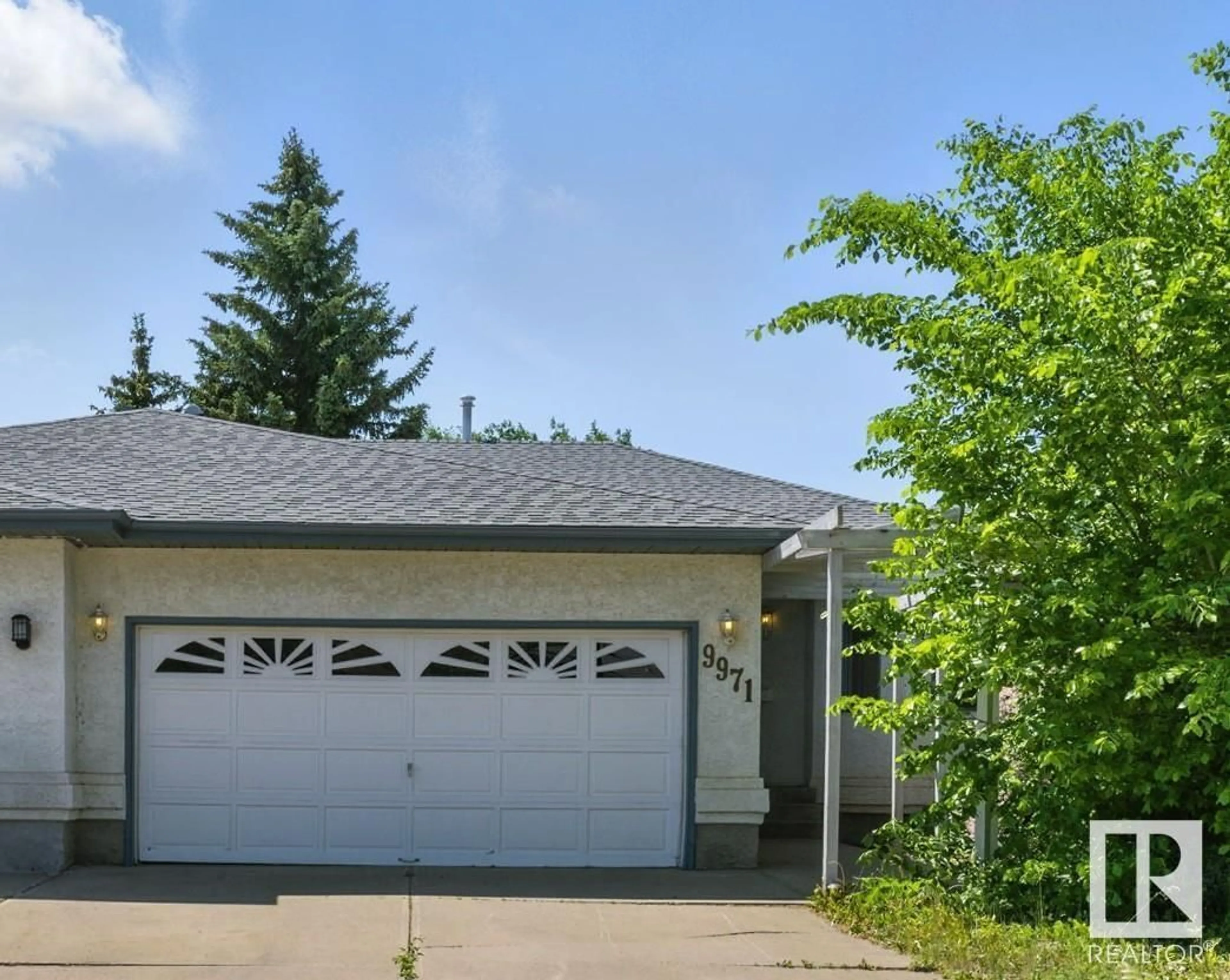 Home with vinyl exterior material, street for 9971 178 AV, Edmonton Alberta T5X5X2