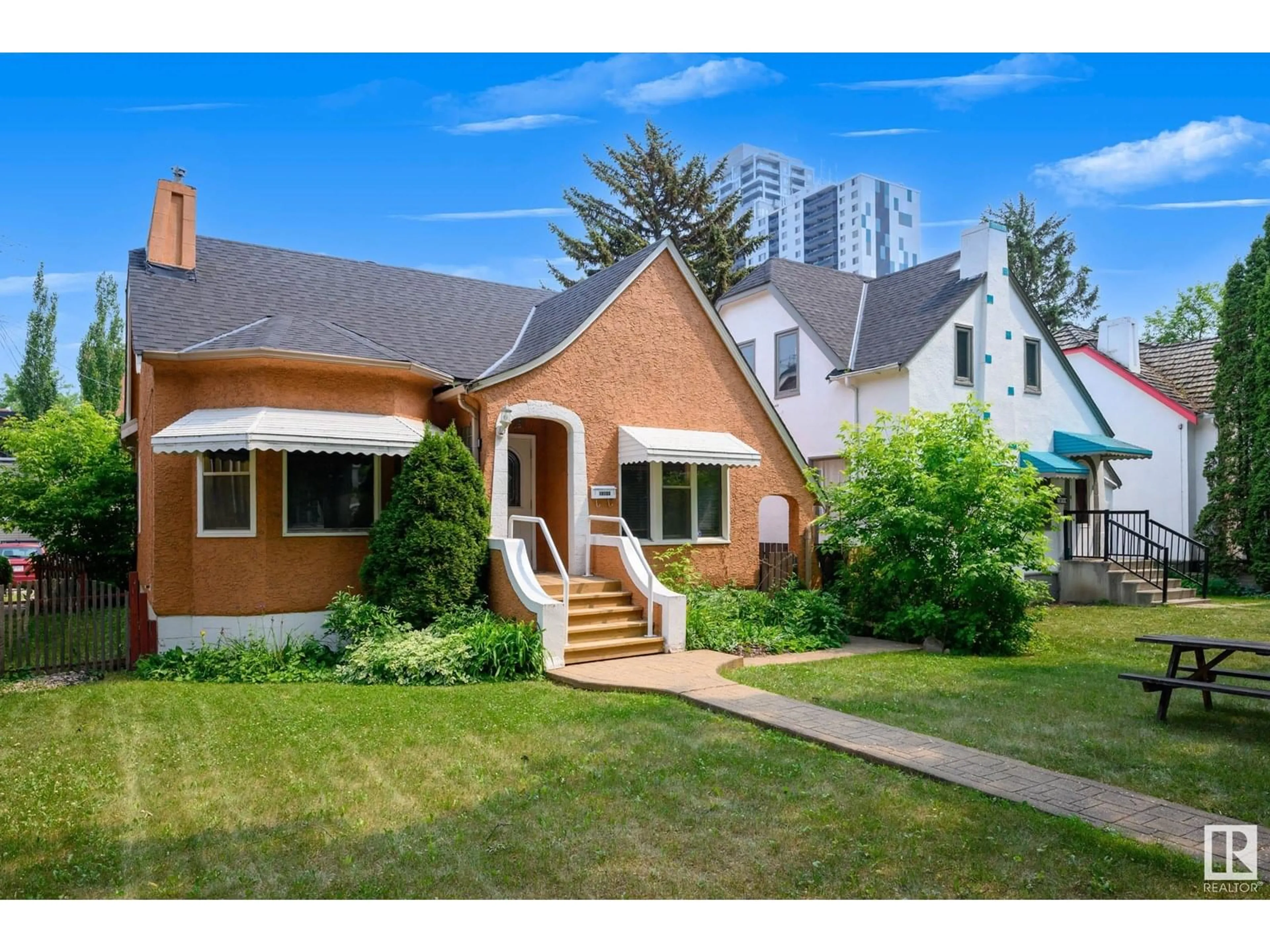 Home with brick exterior material, street for NW - 10153 122 ST, Edmonton Alberta T5N1L7