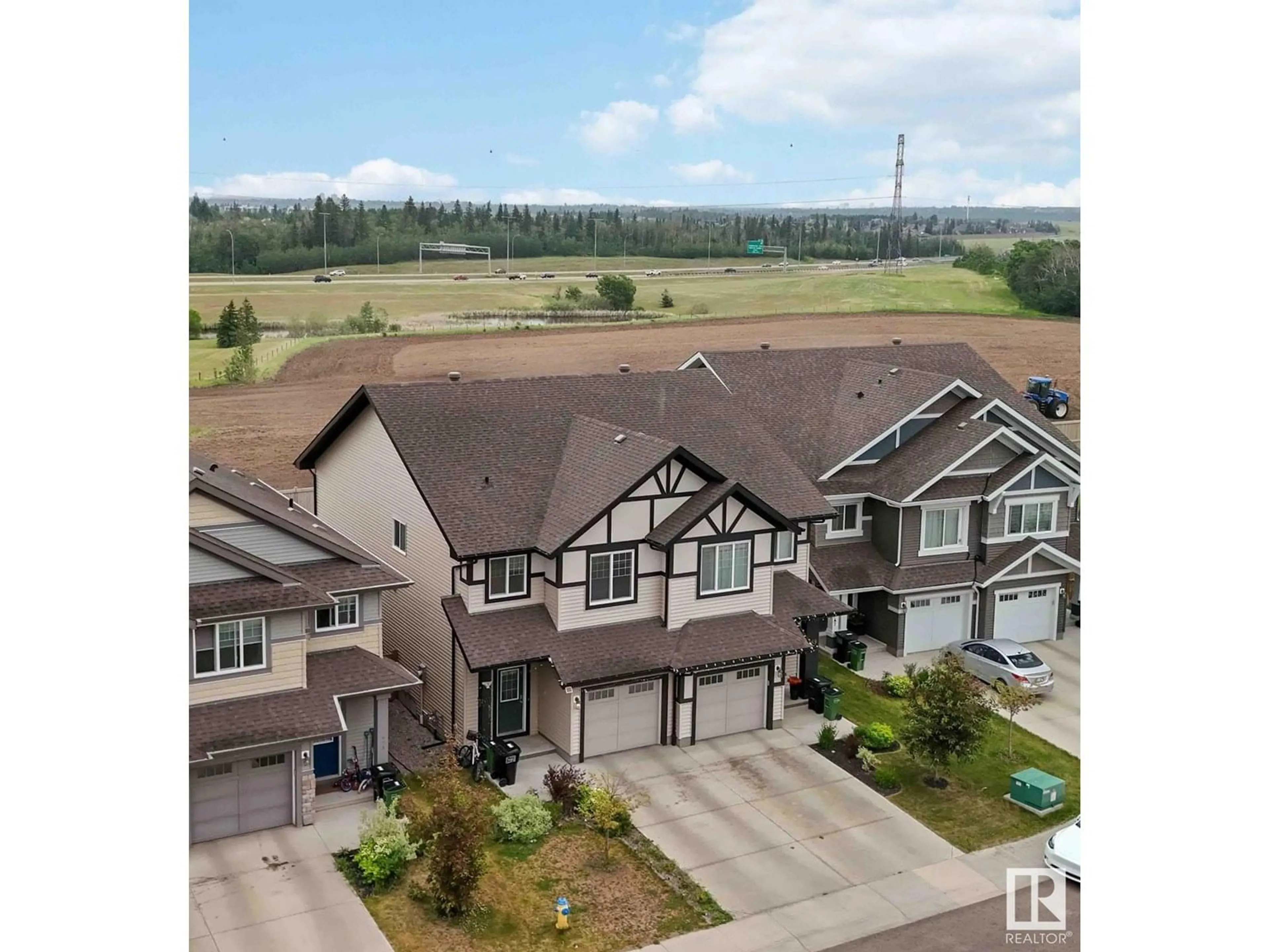 A pic from outside/outdoor area/front of a property/back of a property/a pic from drone, mountain view for 671 EAGLESON CRESCENT, Edmonton Alberta T6M0V7