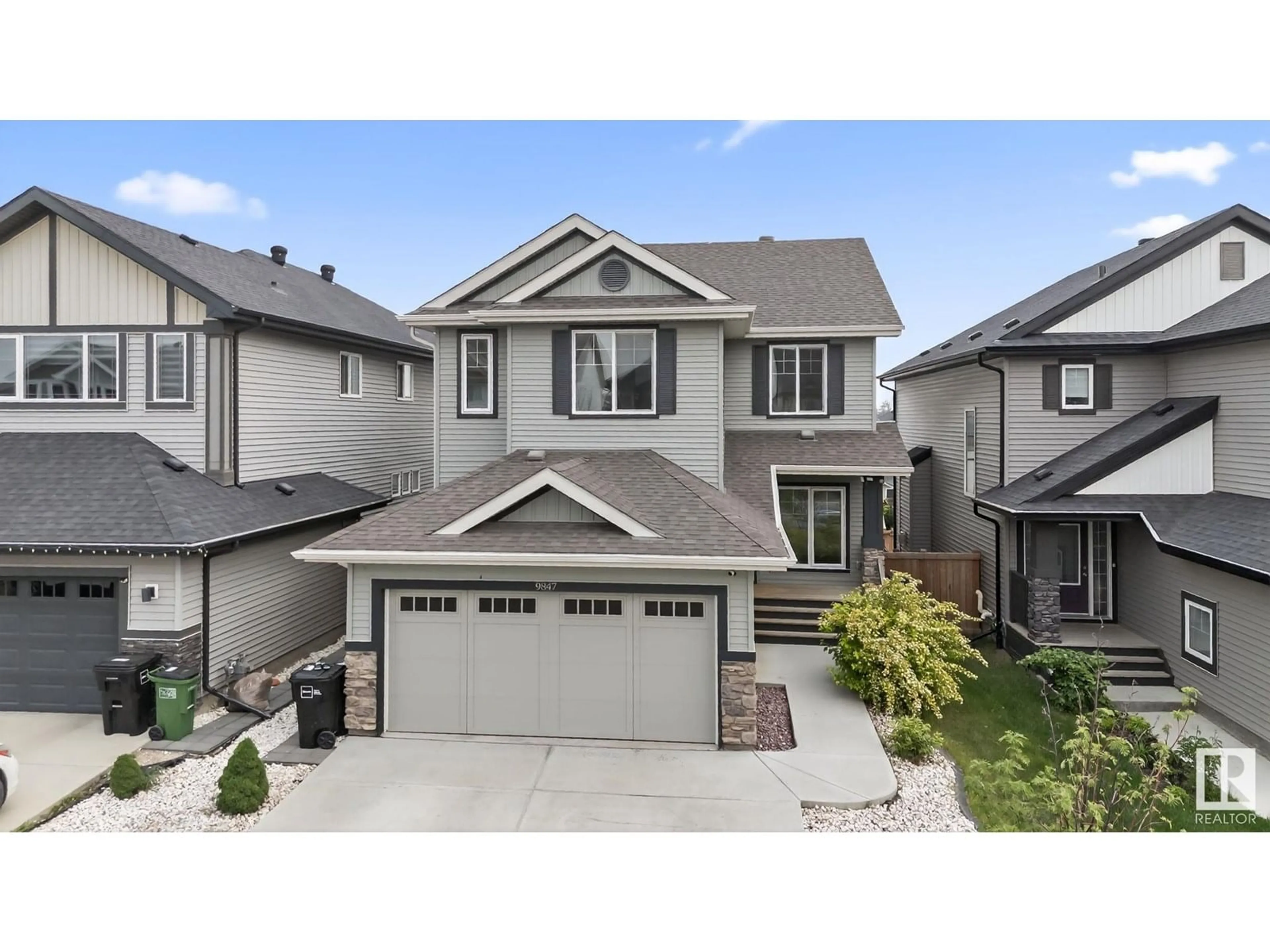 Home with vinyl exterior material, street for NW - 9847 222 ST, Edmonton Alberta T5T4P6