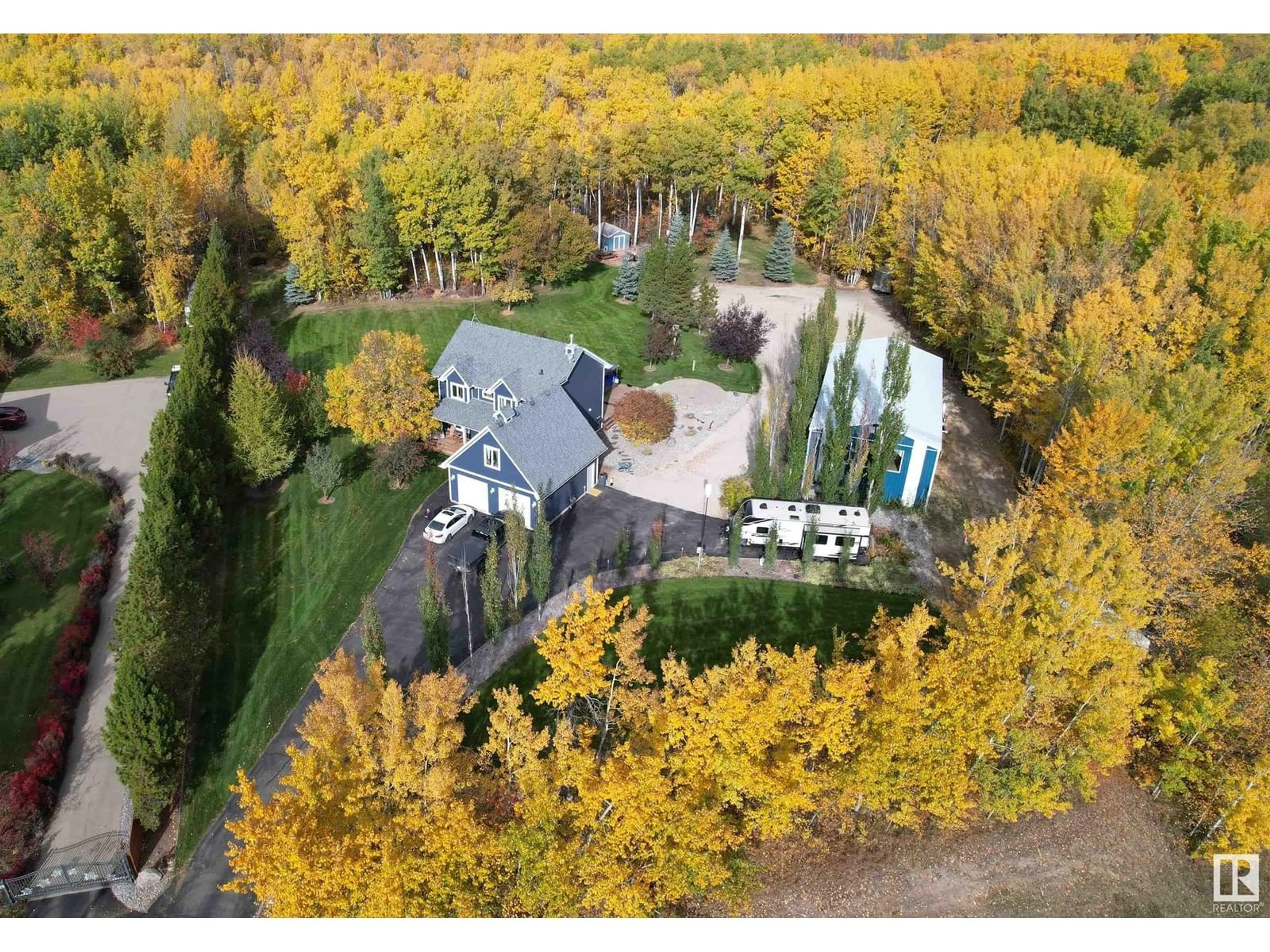 A pic from outside/outdoor area/front of a property/back of a property/a pic from drone, forest/trees view for 4 - 4 TWP ROAD 540 TWP ROAD, Rural Parkland County Alberta T7X3V4
