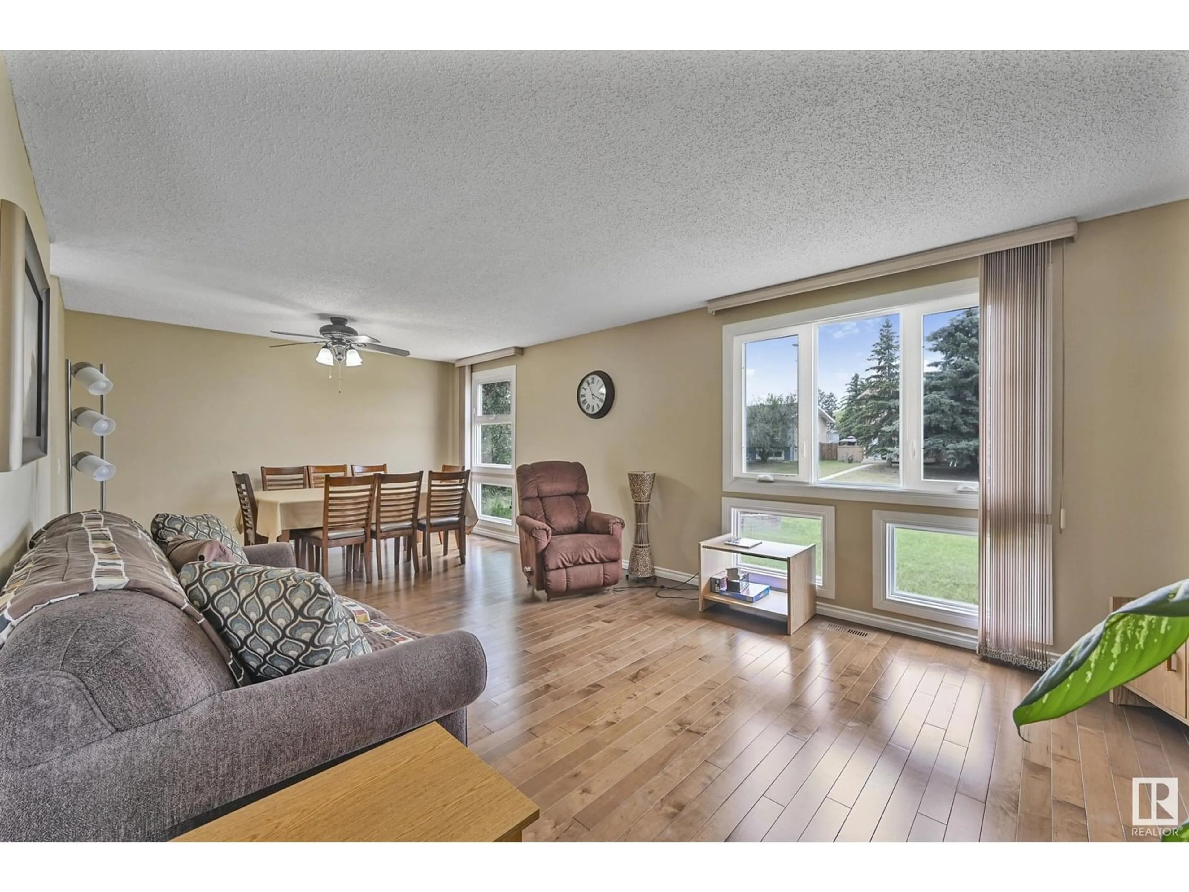Living room with furniture, wood/laminate floor for 1550 LAKEWOOD RD, Edmonton Alberta T6K2V9