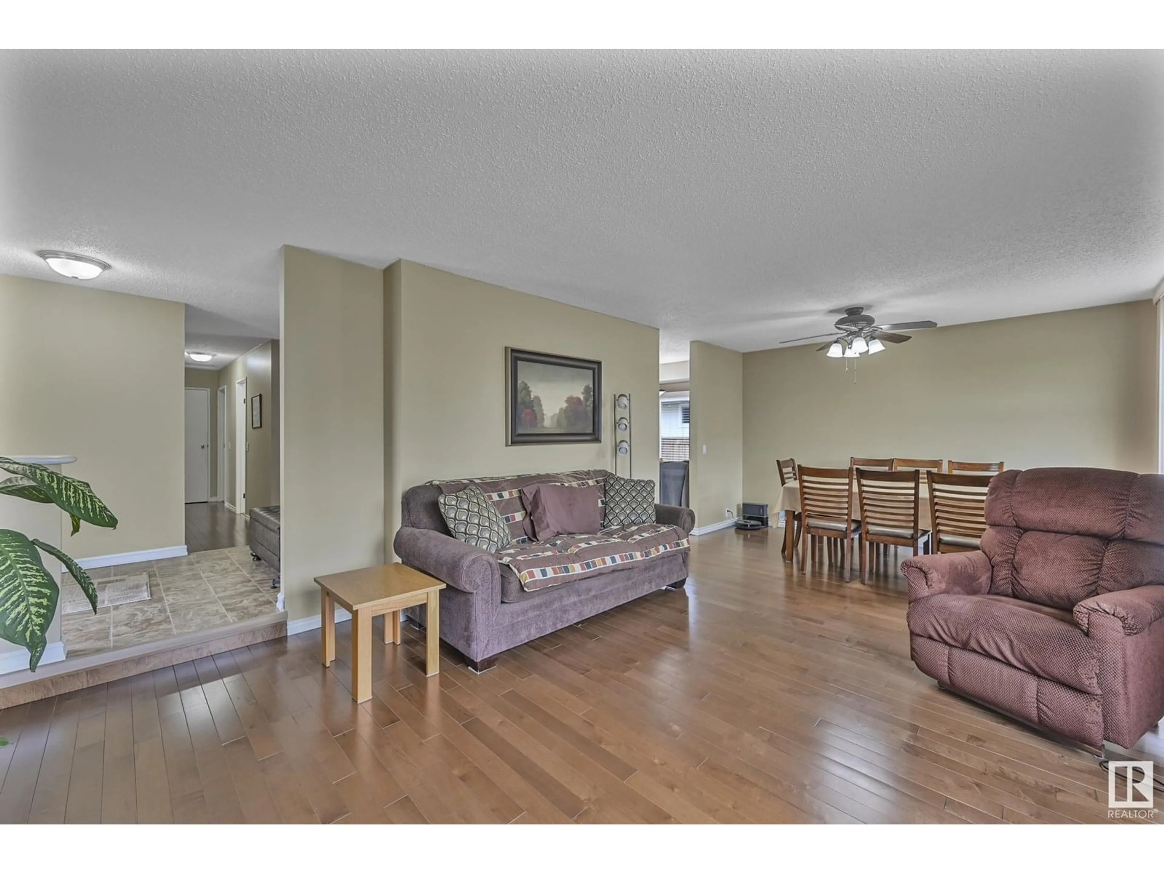Living room with furniture, wood/laminate floor for 1550 LAKEWOOD RD, Edmonton Alberta T6K2V9