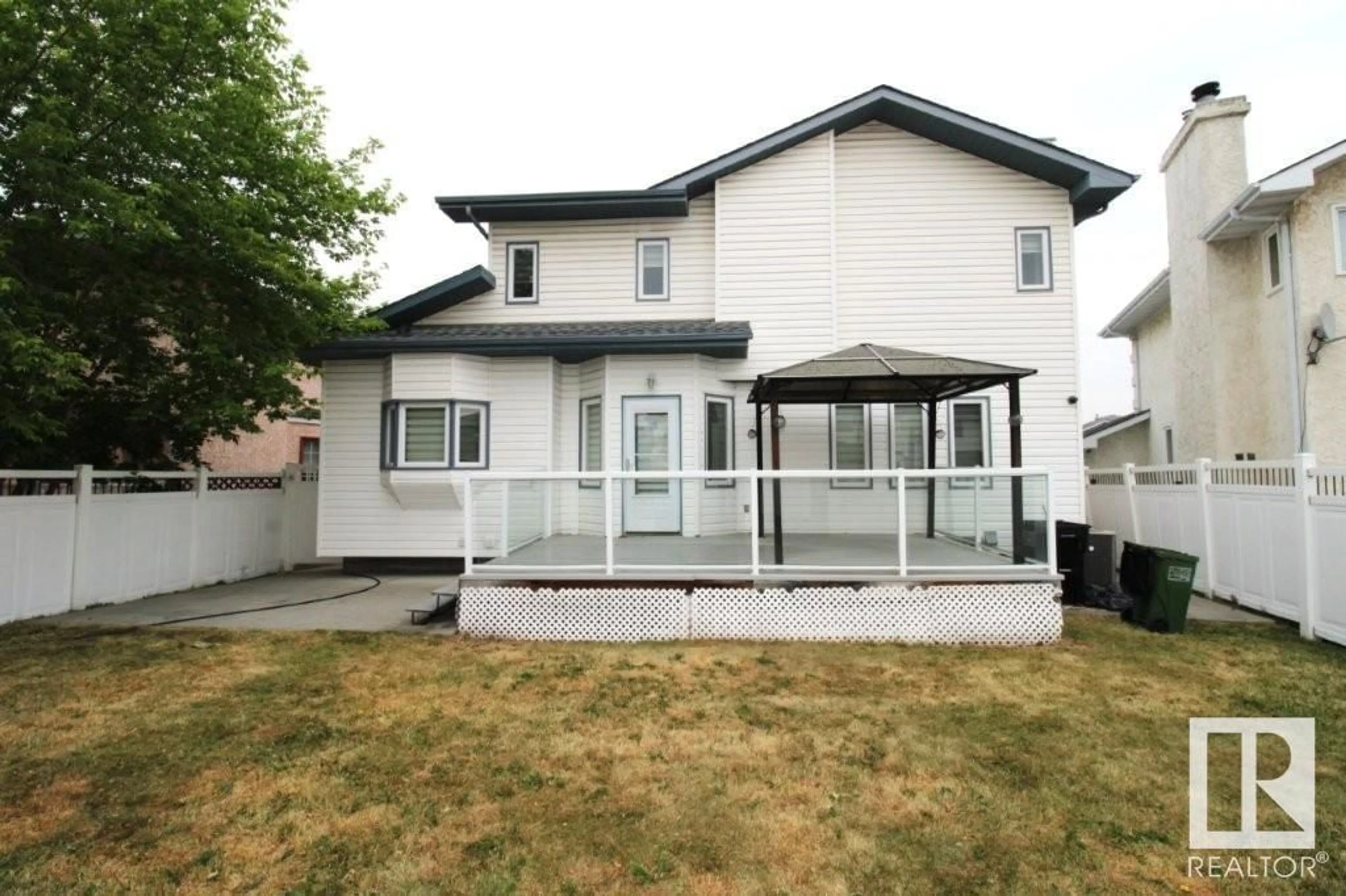Home with vinyl exterior material, street for NW - 6003 156 AV, Edmonton Alberta T5Y2M8