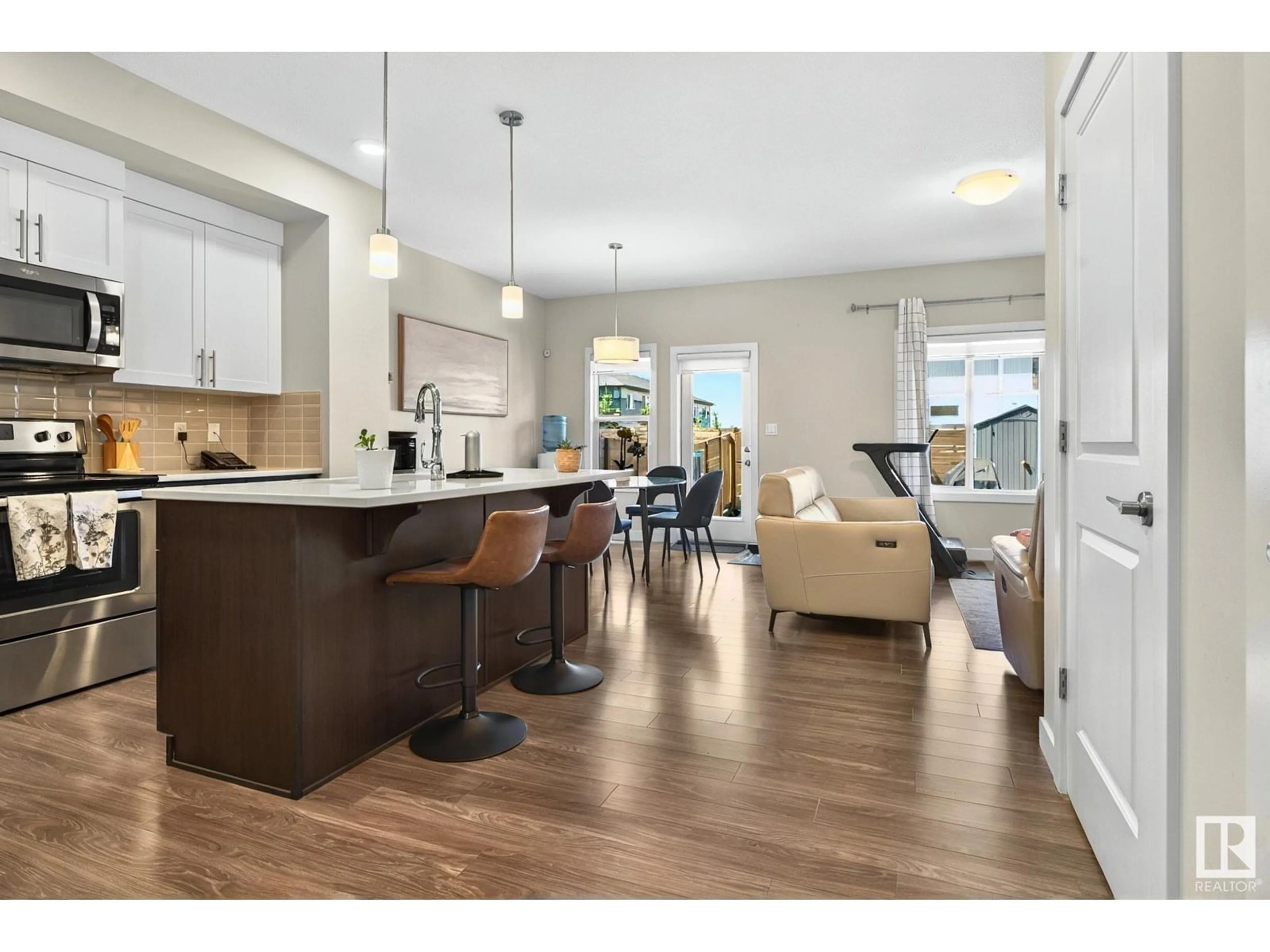 Open concept kitchen, wood/laminate floor for SW - 1813 KEENE CR, Edmonton Alberta T6W3J8