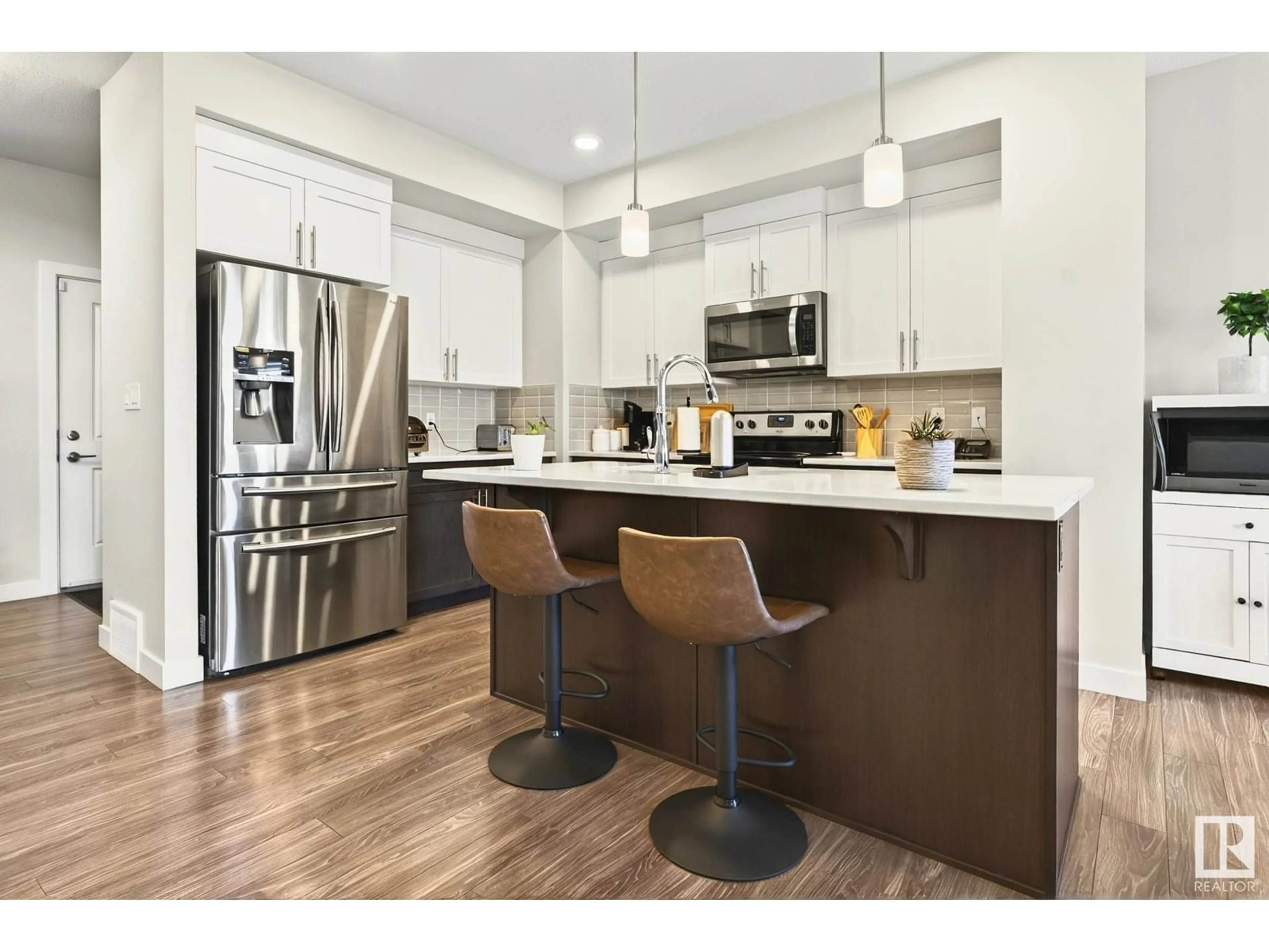 Open concept kitchen, wood/laminate floor for SW - 1813 KEENE CR, Edmonton Alberta T6W3J8