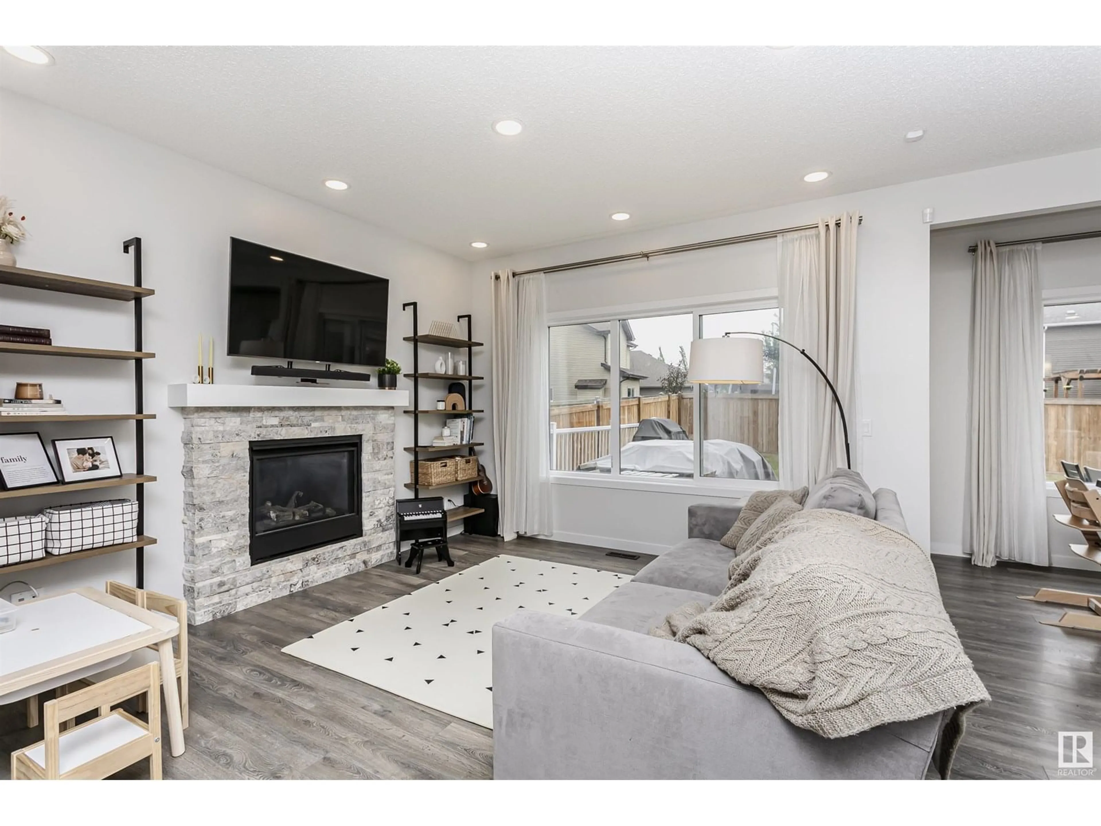 Living room with furniture, wood/laminate floor for 17619 76 ST, Edmonton Alberta T5Z0R3