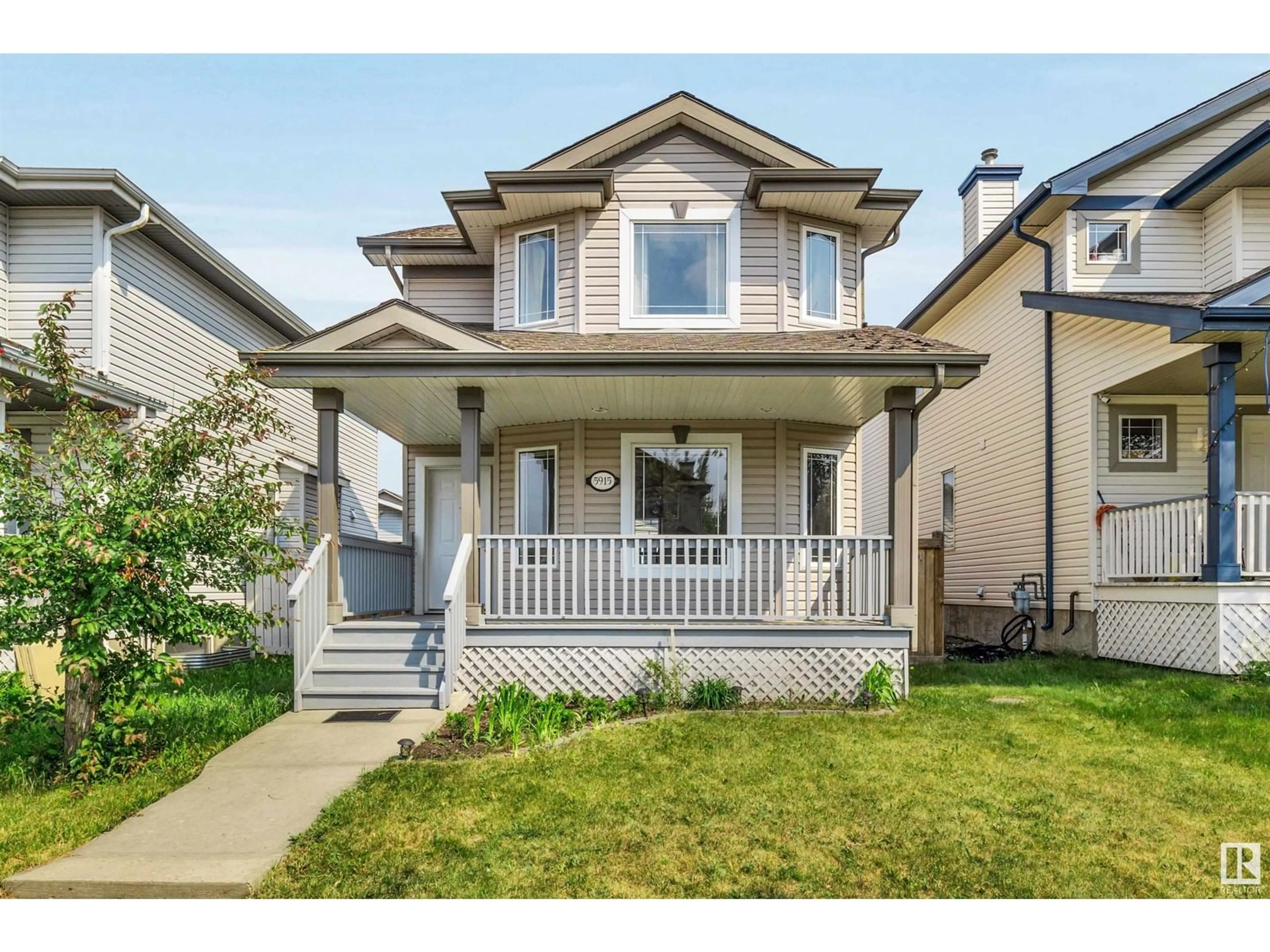 Home with vinyl exterior material, street for NW - 5915 204 ST, Edmonton Alberta T6M2Z2