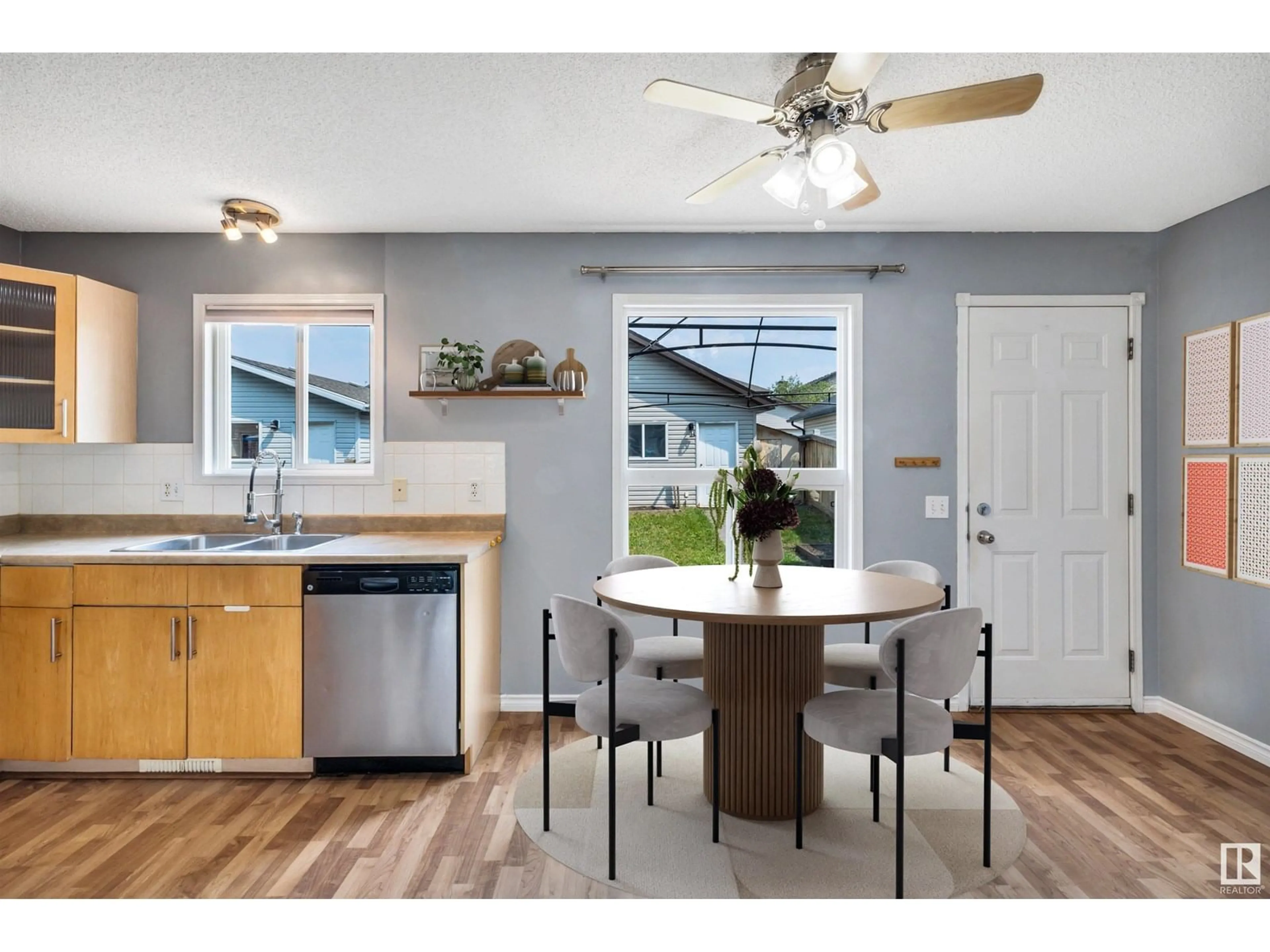 Open concept kitchen, wood/laminate floor for NW - 5915 204 ST, Edmonton Alberta T6M2Z2