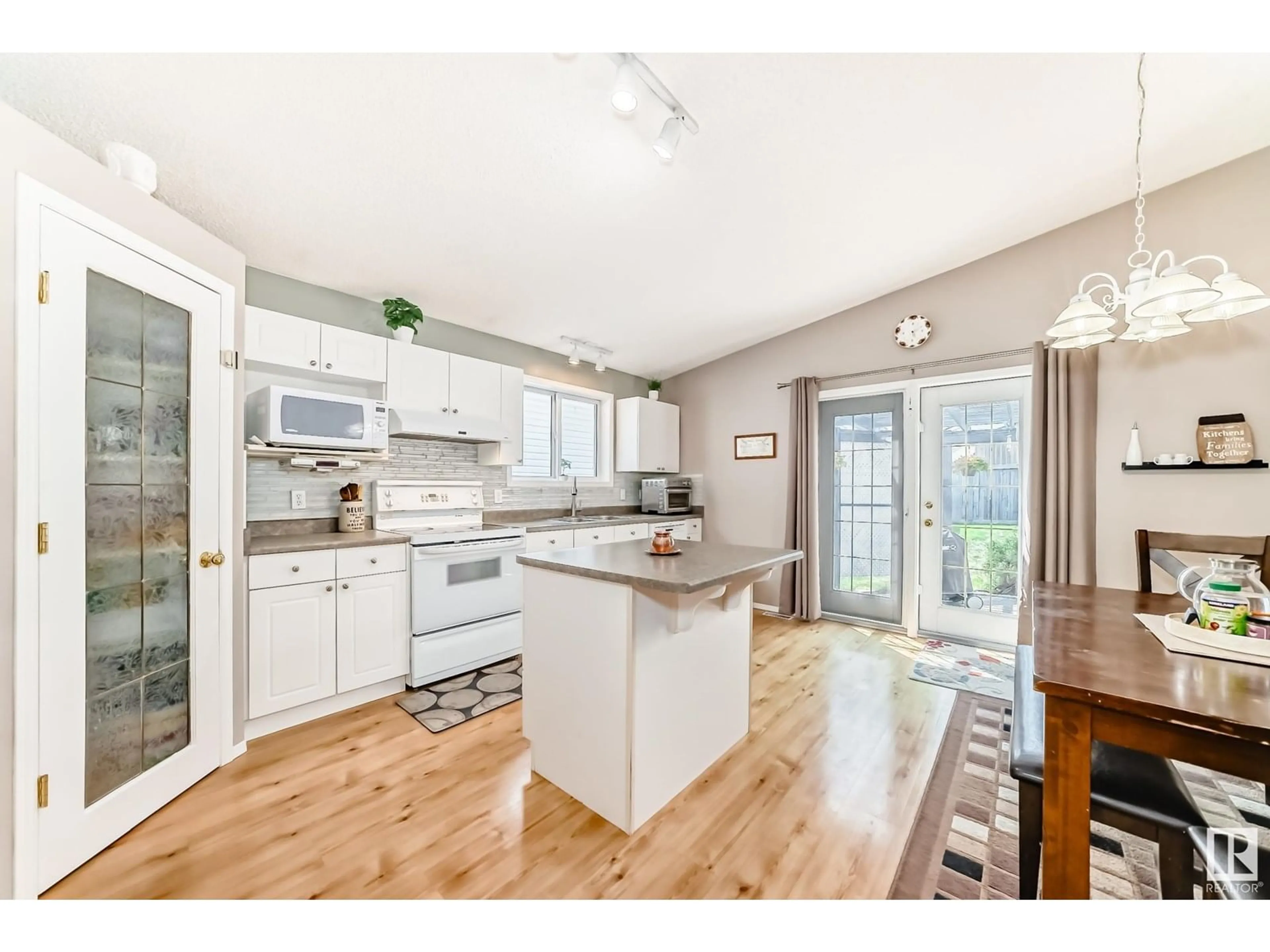 Open concept kitchen, wood/laminate floor for 4 HOLLY PL, St. Albert Alberta T8N6W7