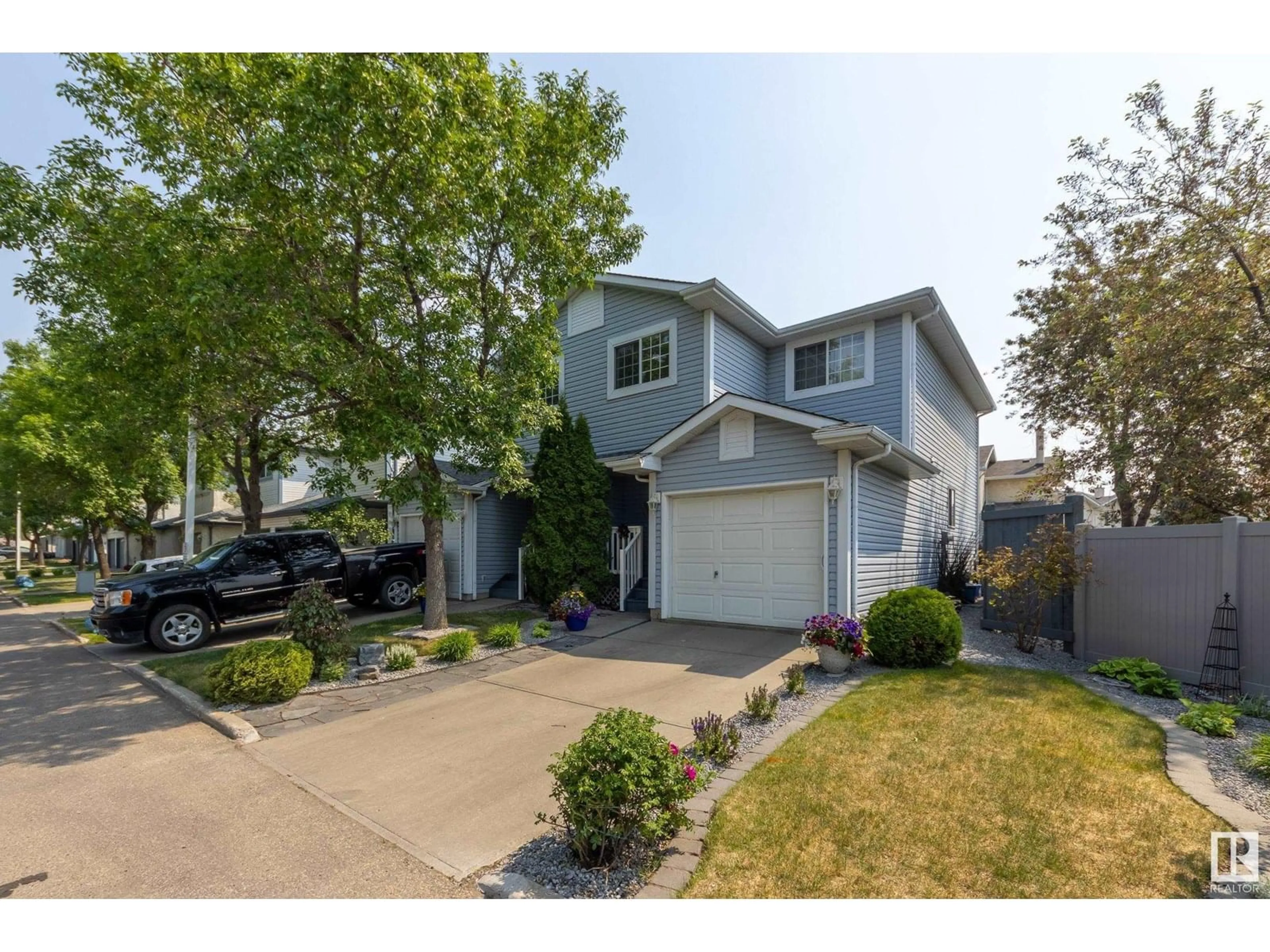 Home with vinyl exterior material, street for 501 YOUVILLE DR E NW, Edmonton Alberta T6L6T8