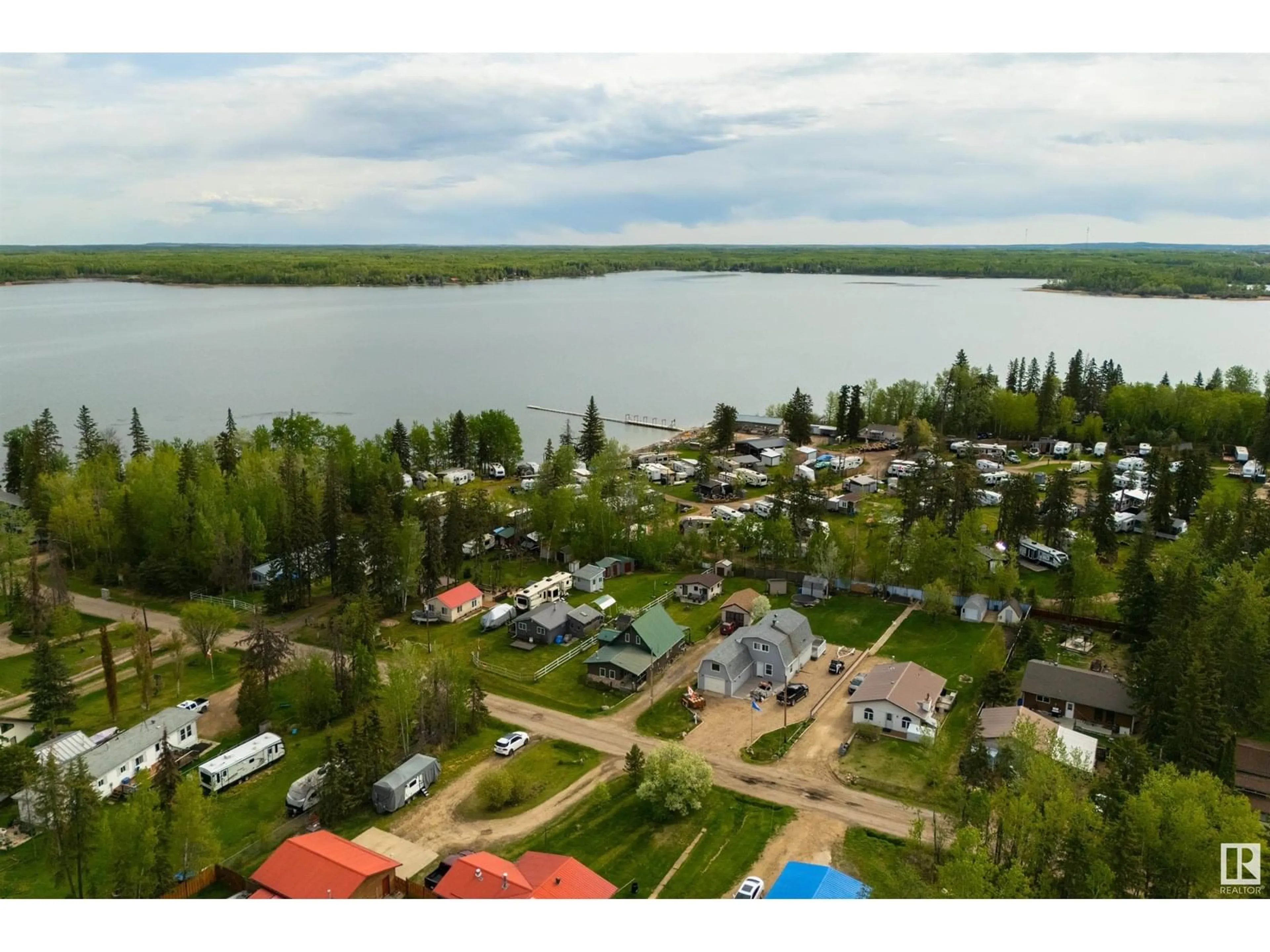A pic from outside/outdoor area/front of a property/back of a property/a pic from drone, water/lake/river/ocean view for 19 - 3016 TWP ROAD 572, Rural Lac Ste. Anne County Alberta T0E1A0