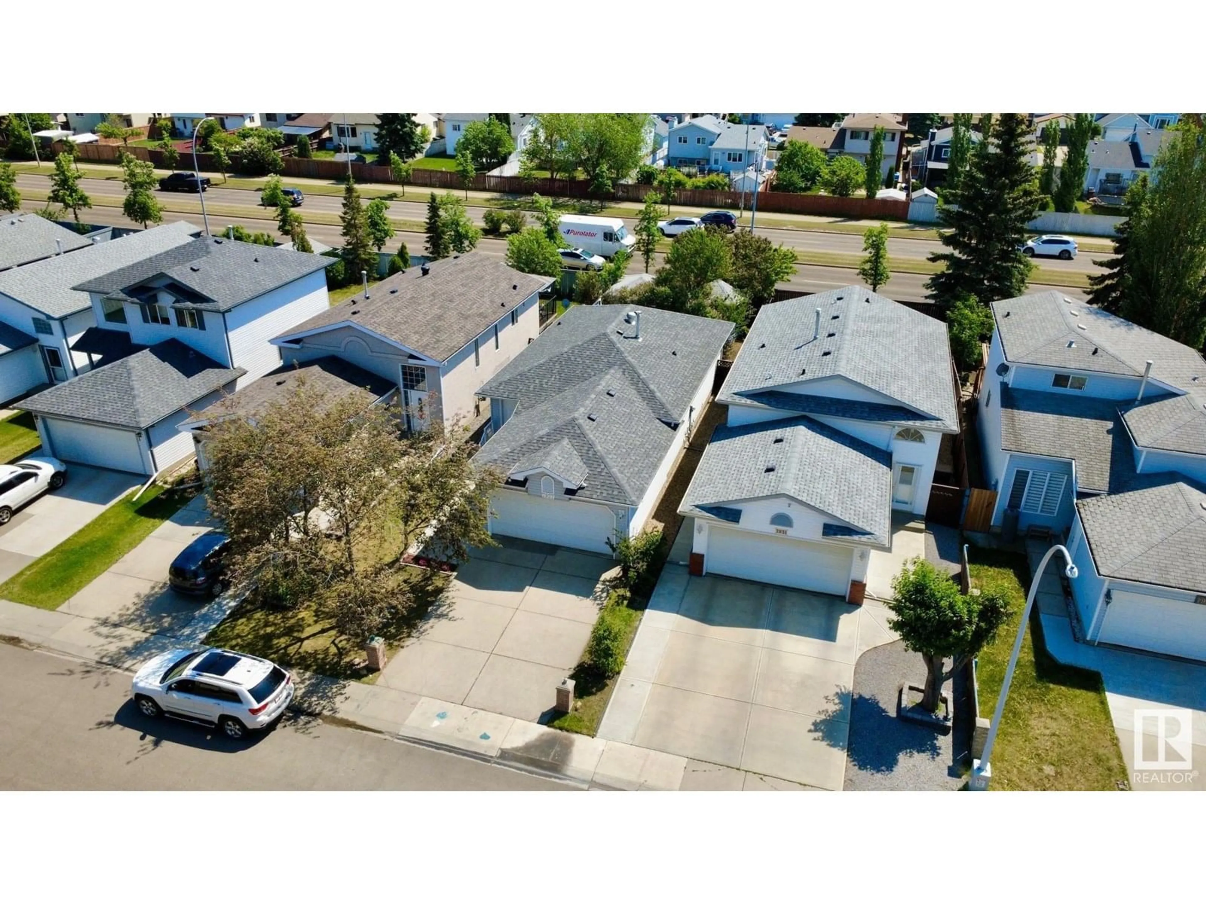 A pic from outside/outdoor area/front of a property/back of a property/a pic from drone, street for 7927 154 AV, Edmonton Alberta T5Z3A9