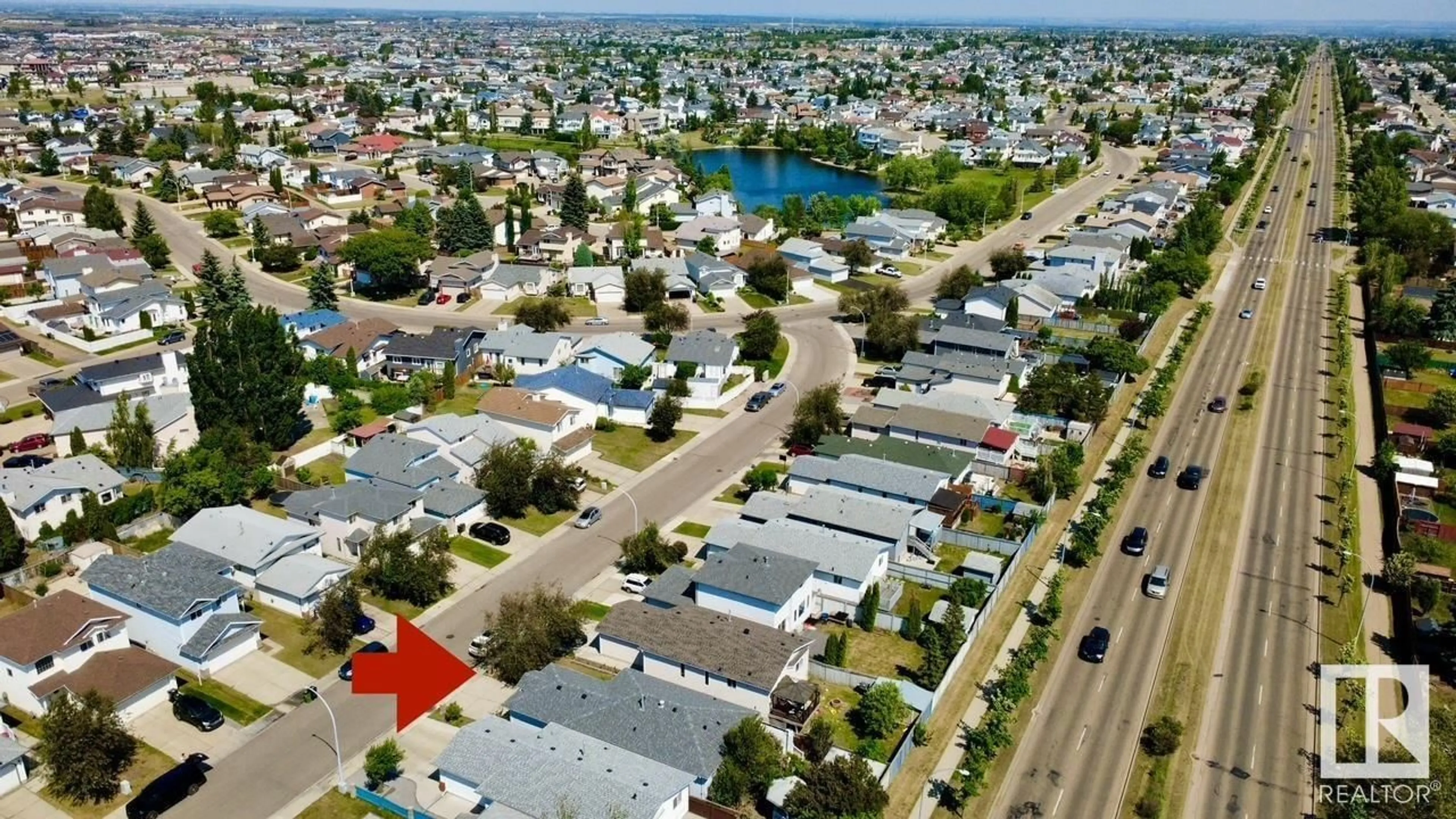 A pic from outside/outdoor area/front of a property/back of a property/a pic from drone, street for 7927 154 AV, Edmonton Alberta T5Z3A9
