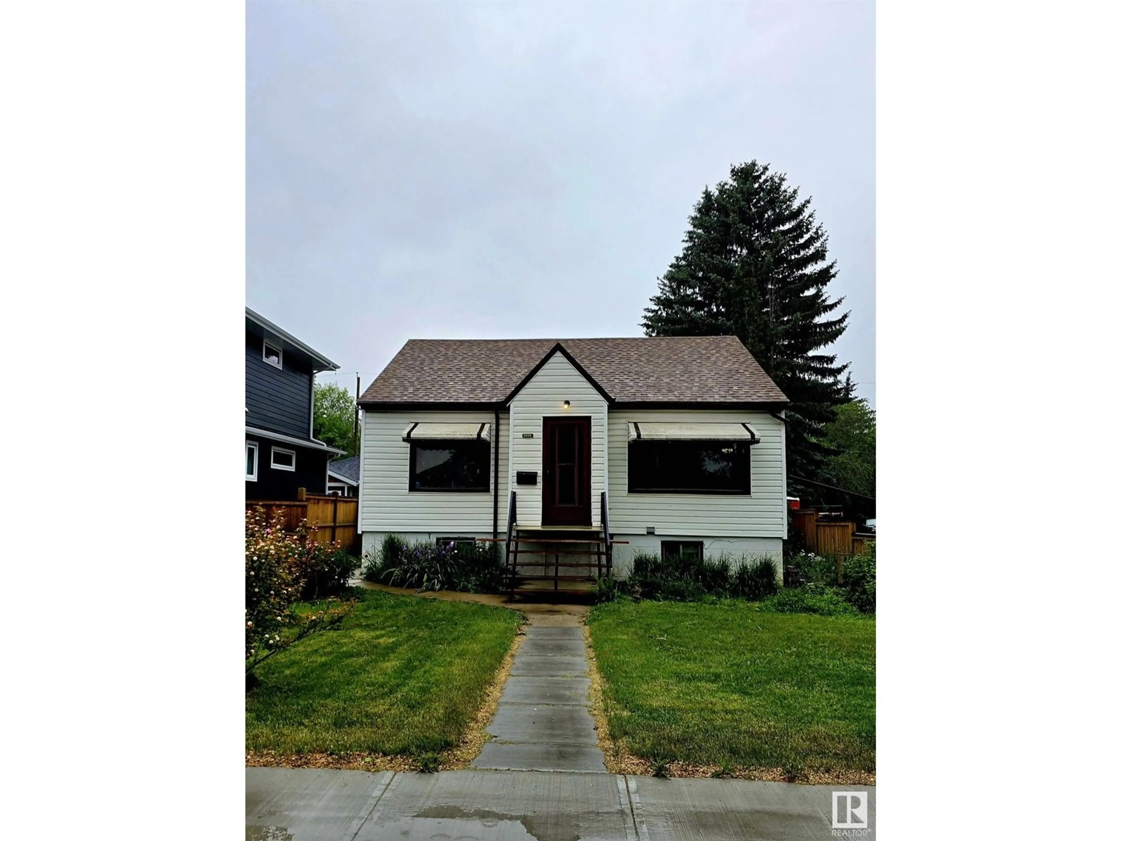 Home with vinyl exterior material, street for NW - 6028 106 ST, Edmonton Alberta T6H2T7