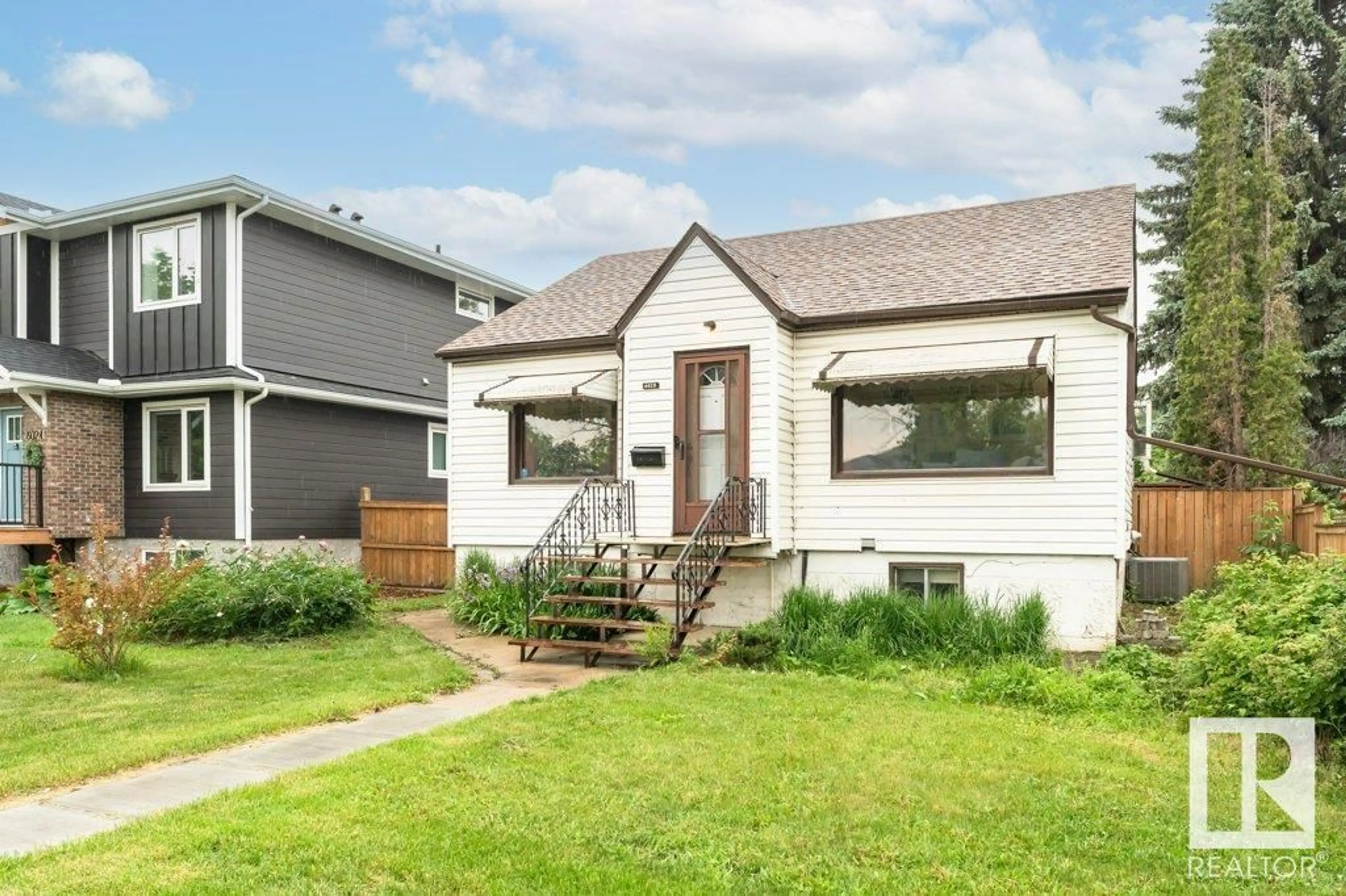 Home with vinyl exterior material, street for NW - 6028 106 ST, Edmonton Alberta T6H2T7