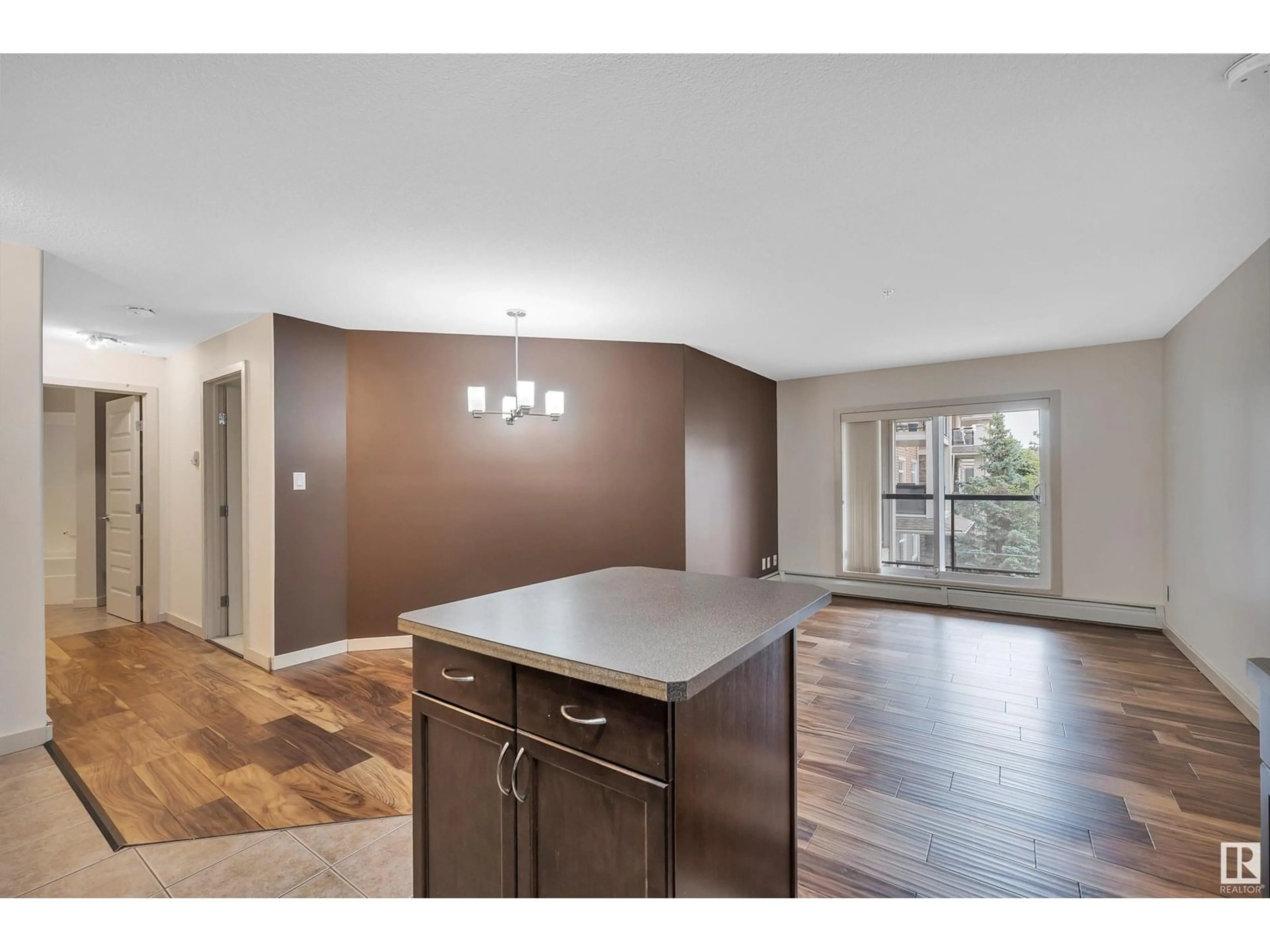 Open concept kitchen, wood/laminate floor for 11615 - 316 ELLERSLIE RD, Edmonton Alberta T6W0J3
