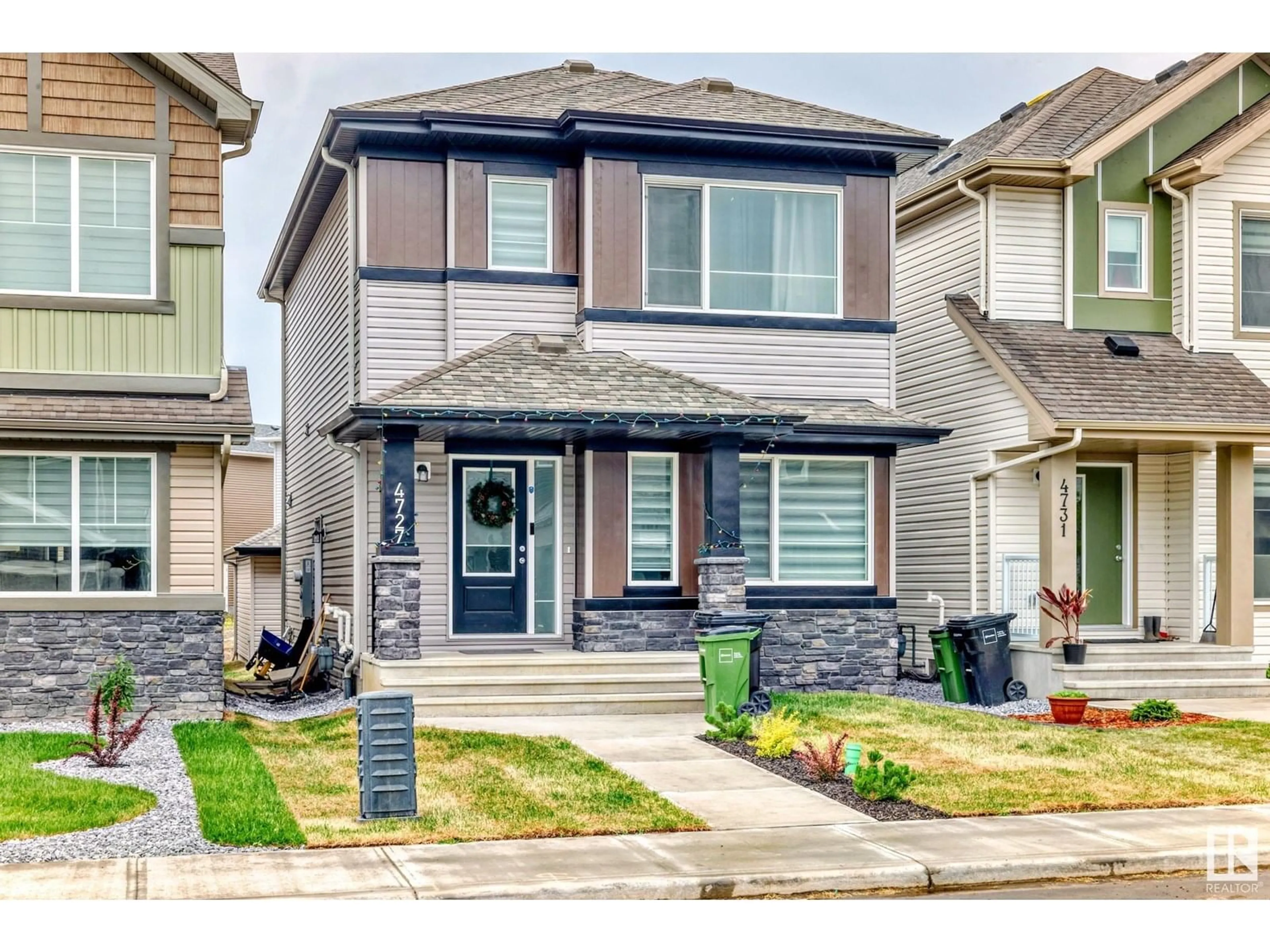 Home with vinyl exterior material, street for 4727 177 AV, Edmonton Alberta T5Y4G4