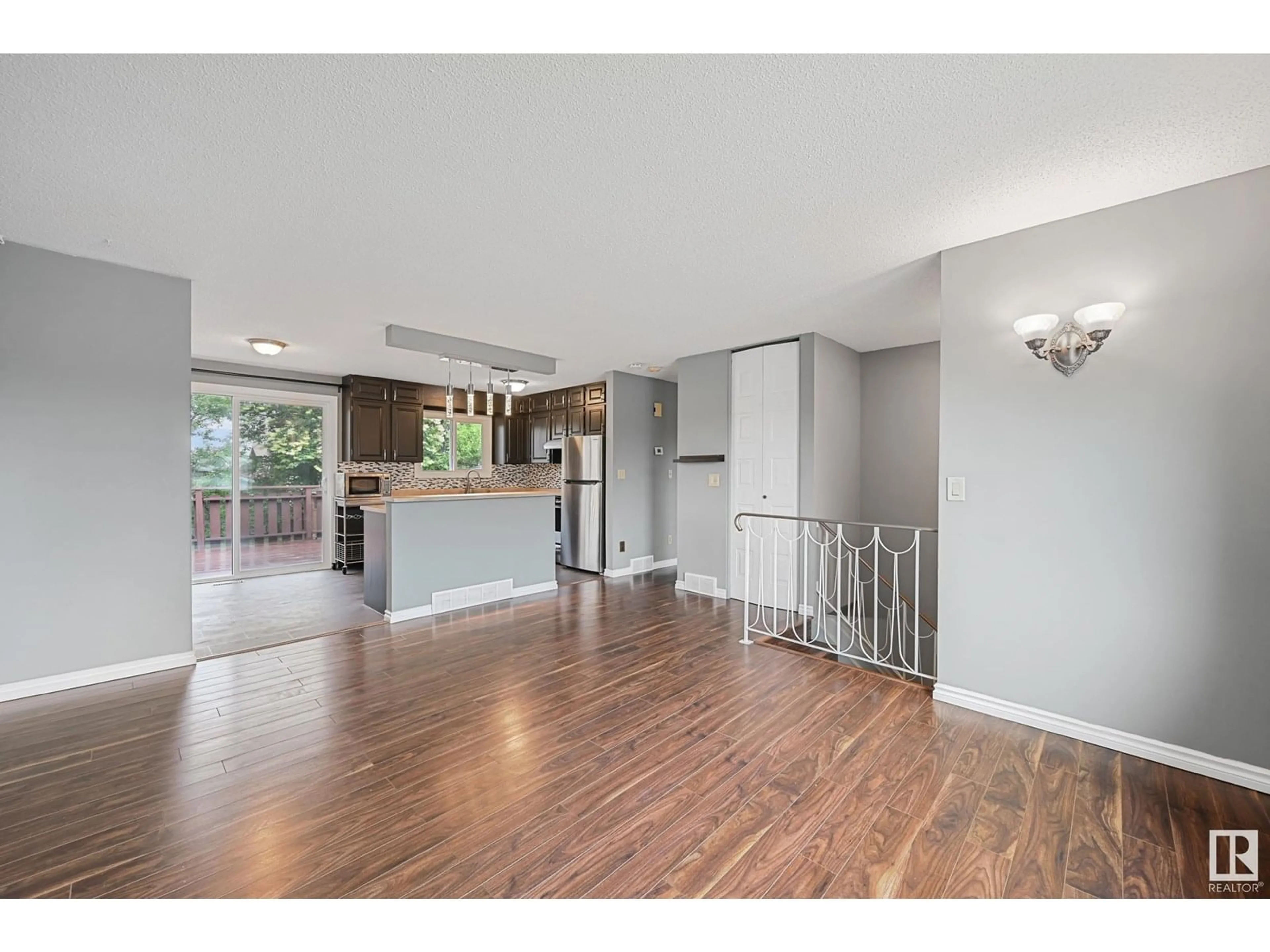 Open concept kitchen, wood/laminate floor for 10207 169 AV, Edmonton Alberta T5X4M1