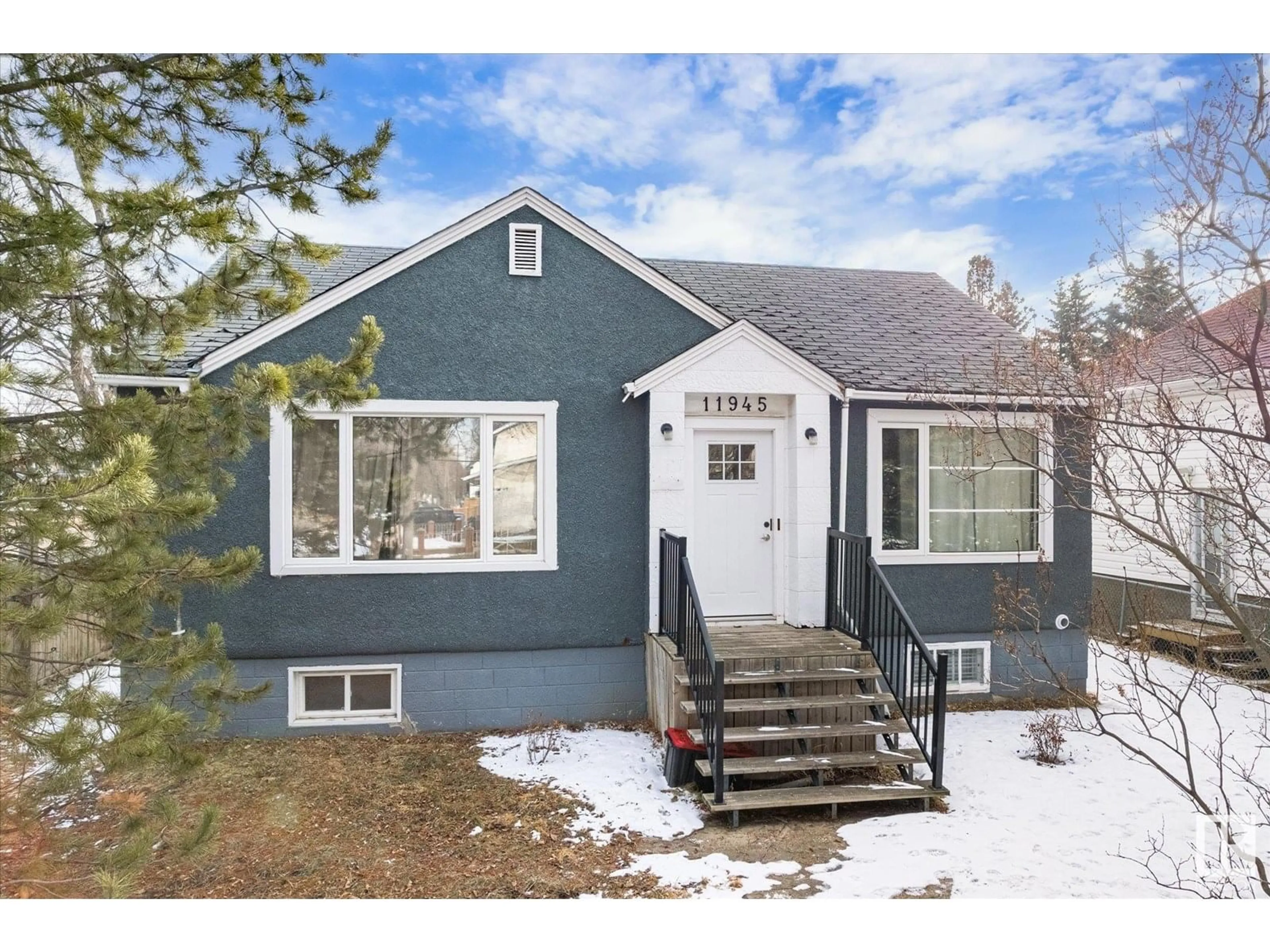 Home with vinyl exterior material, street for NW - 11945 87 ST, Edmonton Alberta T5B3N3