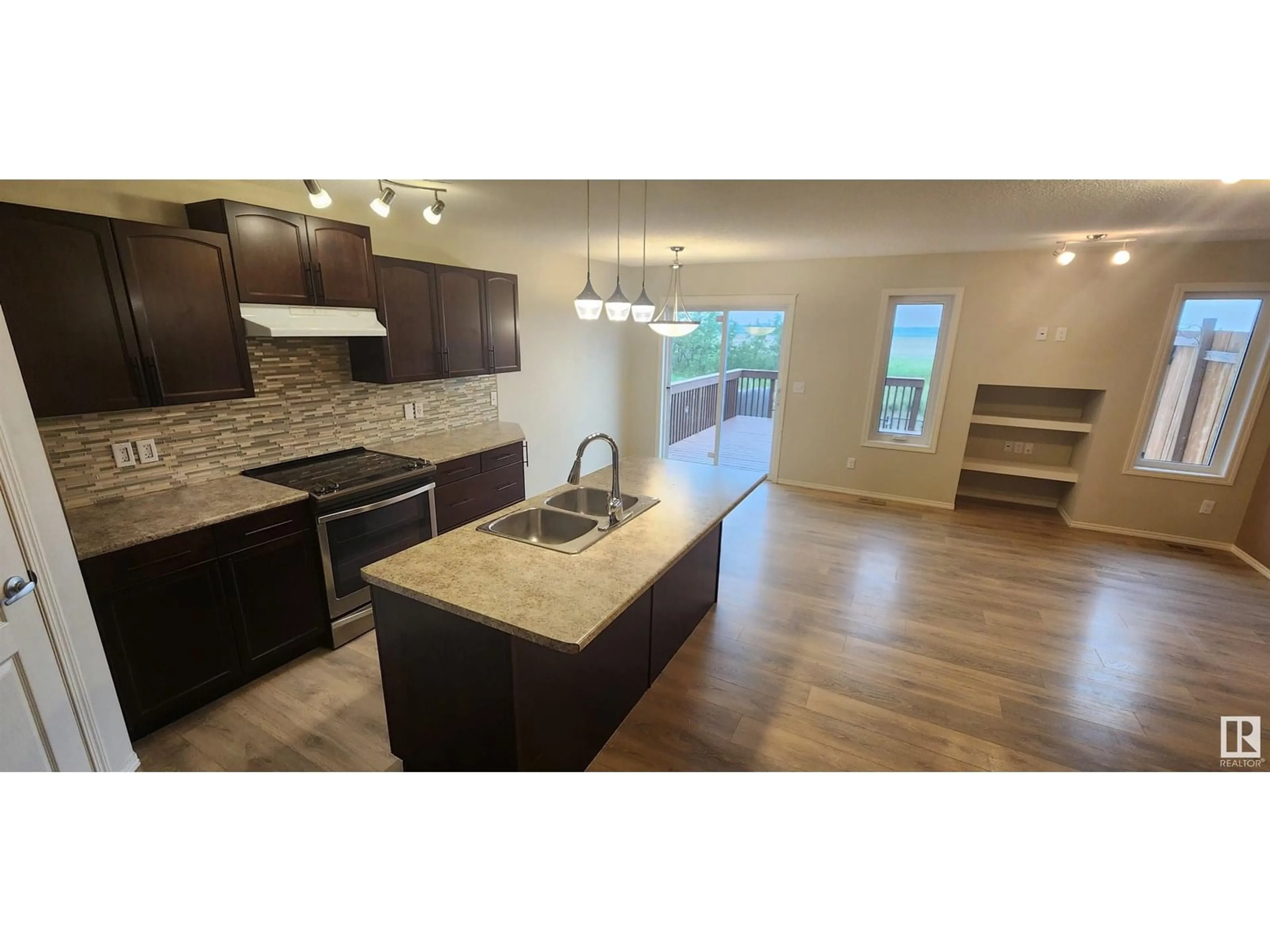 Open concept kitchen, wood/laminate floor for 145 SANTANA CR, Fort Saskatchewan Alberta T8L0T2