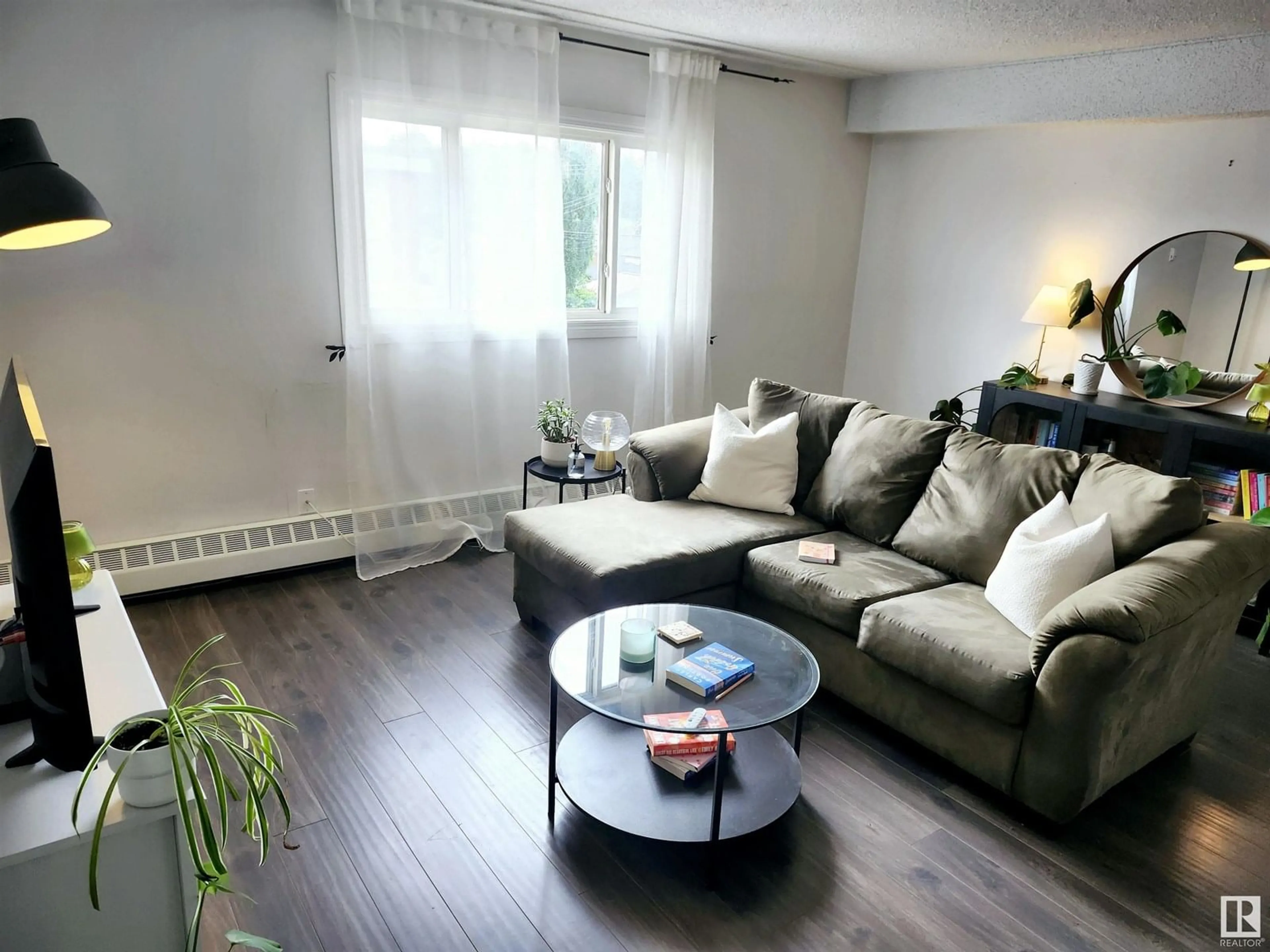 Living room with furniture, wood/laminate floor for #10 - 9630 82 AV, Edmonton Alberta T6C1A1