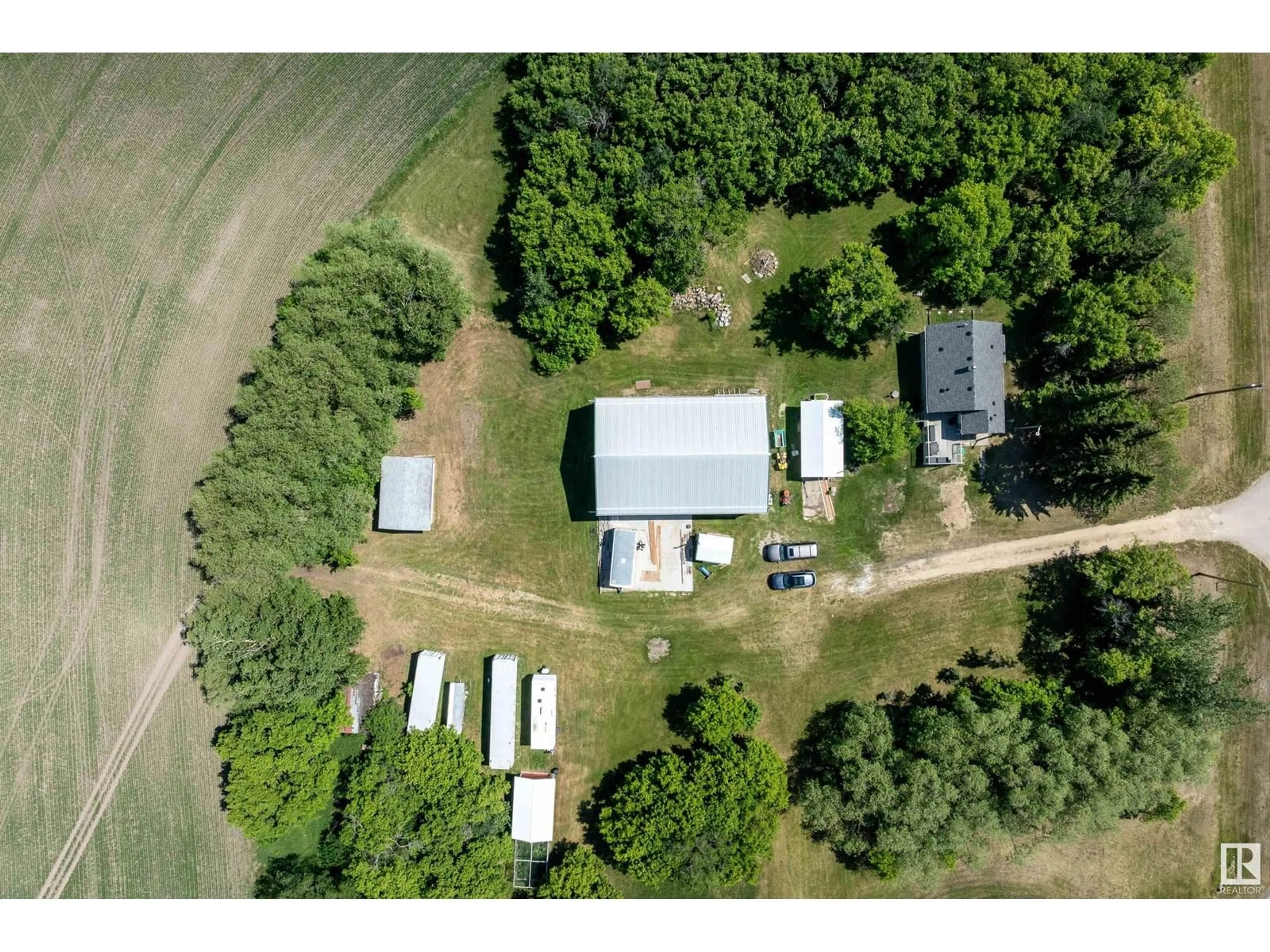 A pic from outside/outdoor area/front of a property/back of a property/a pic from drone, unknown for 26114 TWP ROAD 490, Rural Leduc County Alberta T4X2E9