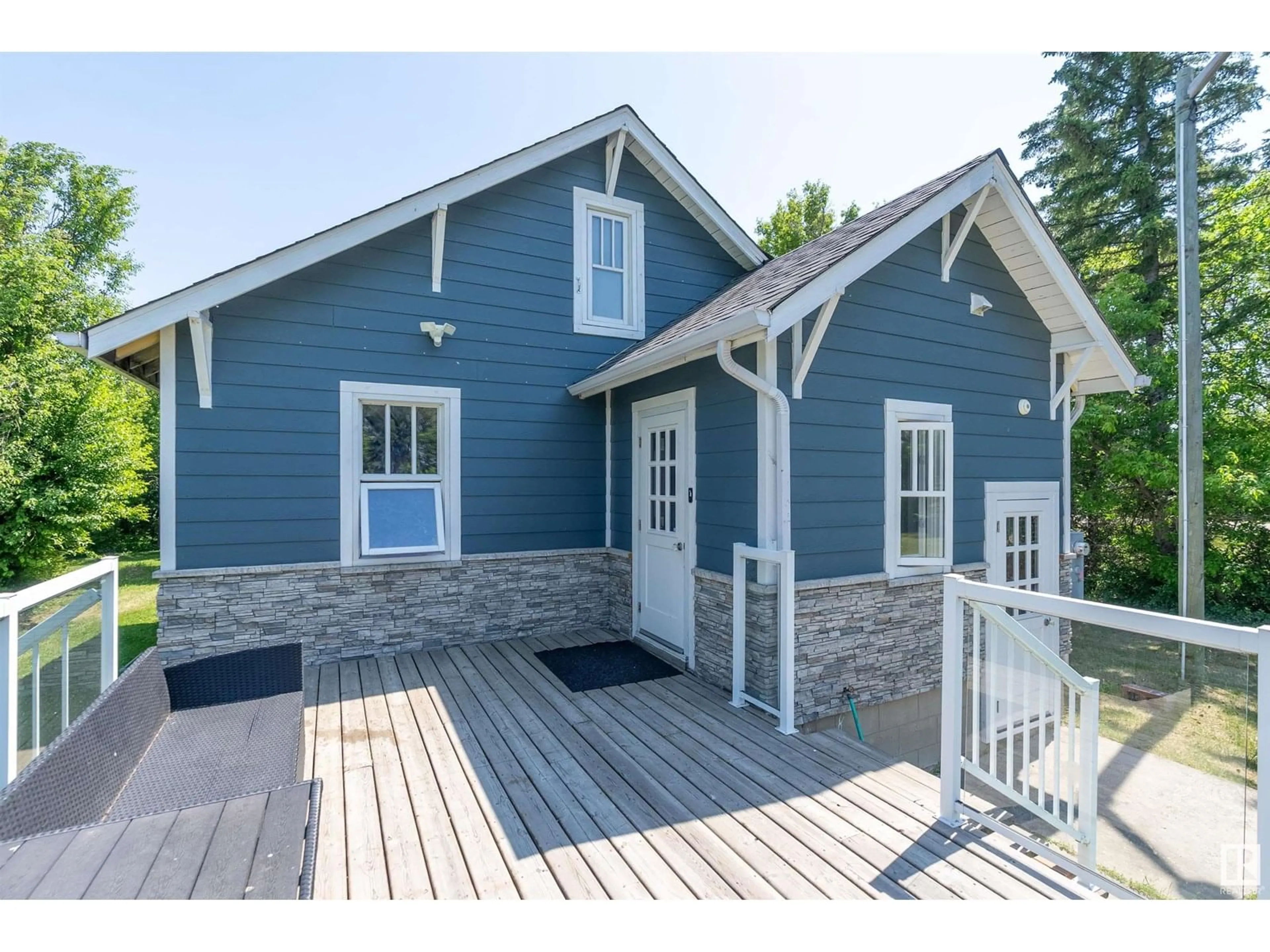 Home with vinyl exterior material, street for 26114 TWP ROAD 490, Rural Leduc County Alberta T4X2E9
