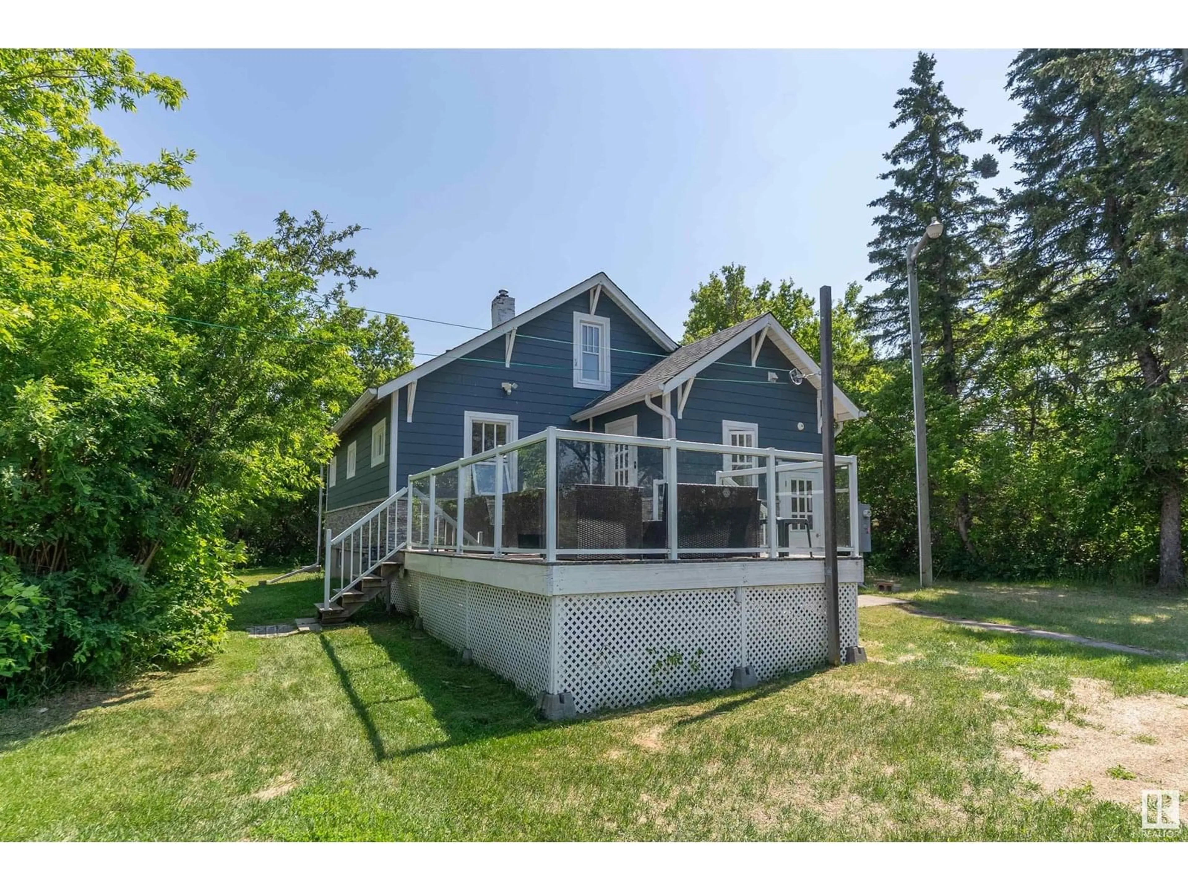 A pic from outside/outdoor area/front of a property/back of a property/a pic from drone, water/lake/river/ocean view for 26114 TWP ROAD 490, Rural Leduc County Alberta T4X2E9