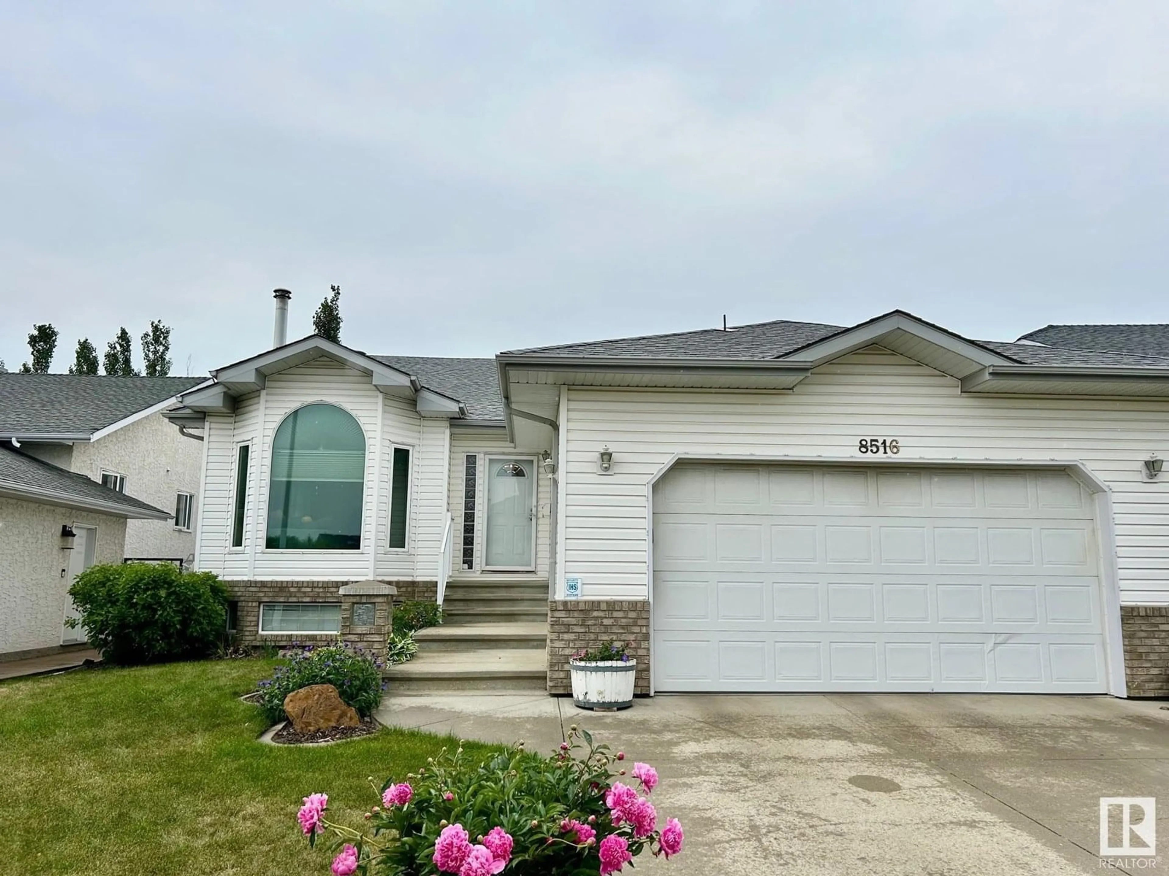 Home with vinyl exterior material, street for 8516 158A AV, Edmonton Alberta T5Z3B6