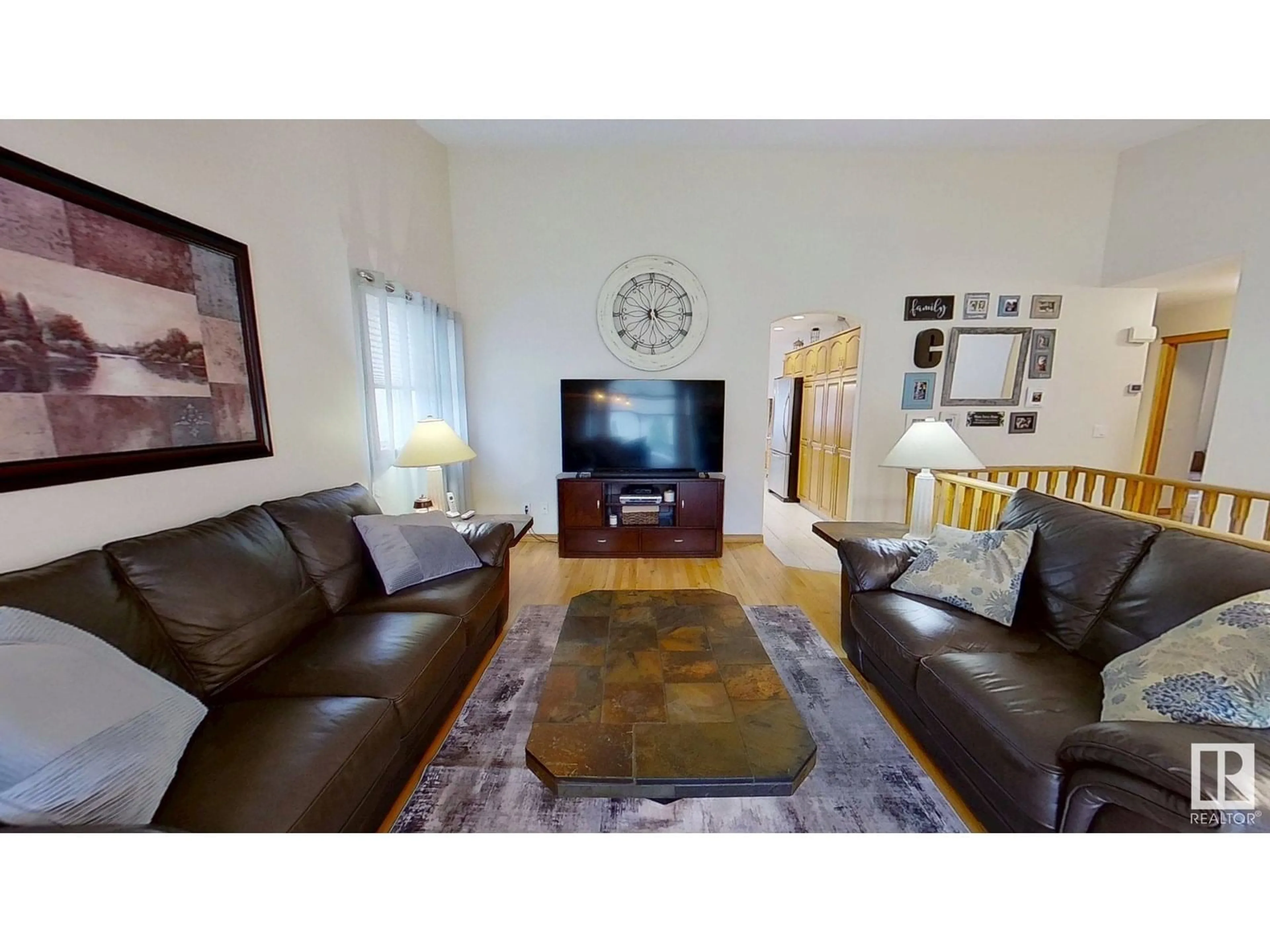 Living room with furniture, wood/laminate floor for 8516 158A AV, Edmonton Alberta T5Z3B6