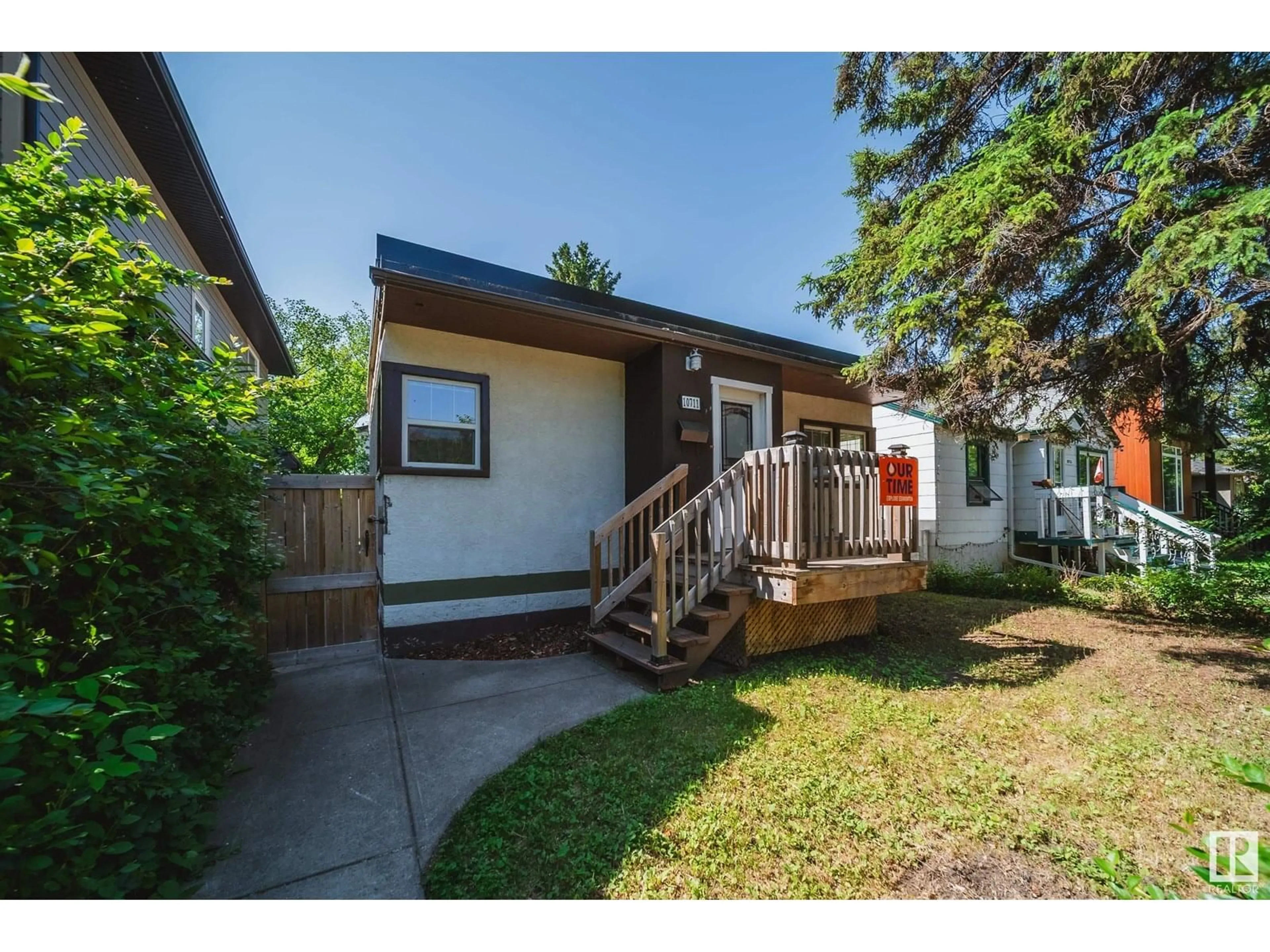Home with vinyl exterior material, street for 10711 76 AV, Edmonton Alberta T6E1L8