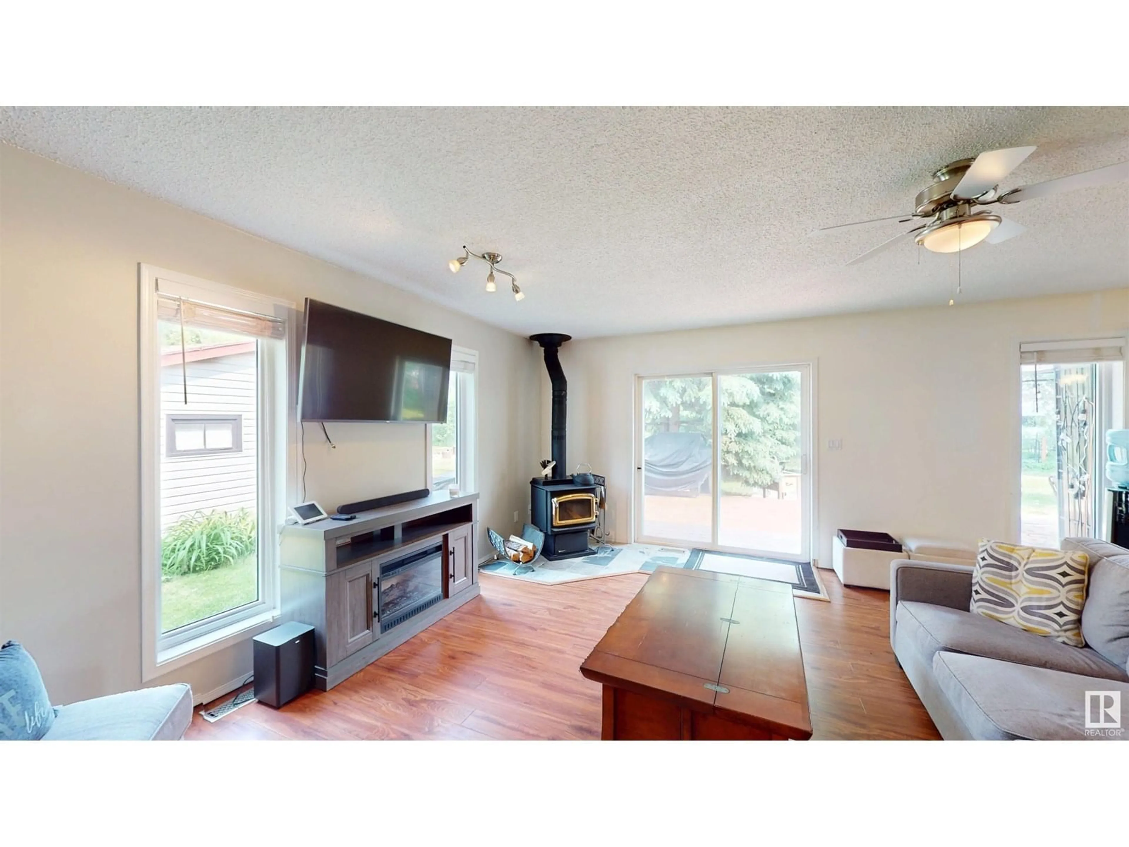 Living room with furniture, wood/laminate floor for 4319 LAKESHORE RD, Rural Parkland County Alberta T0E0H0