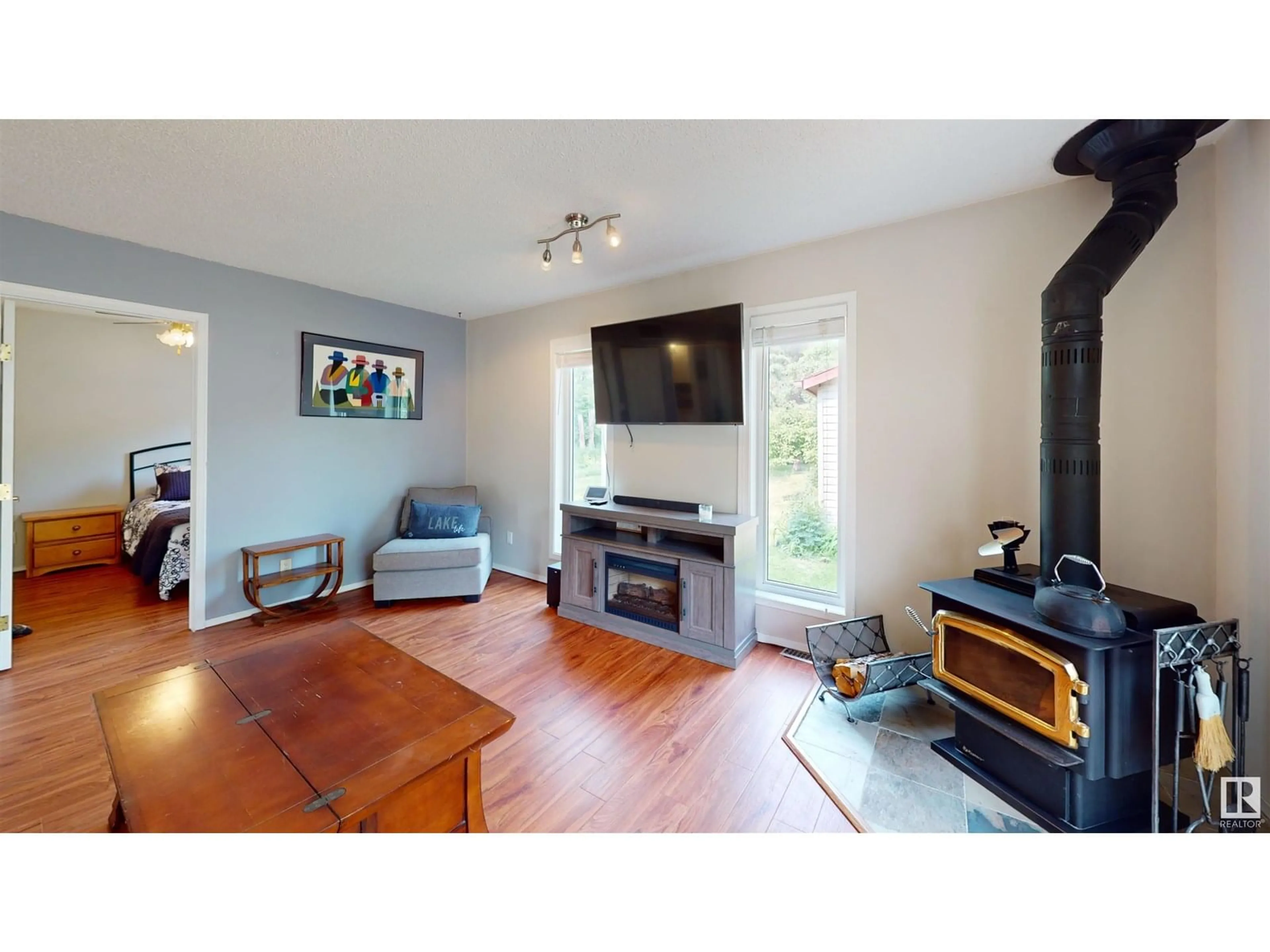 Living room with furniture, wood/laminate floor for 4319 LAKESHORE RD, Rural Parkland County Alberta T0E0H0