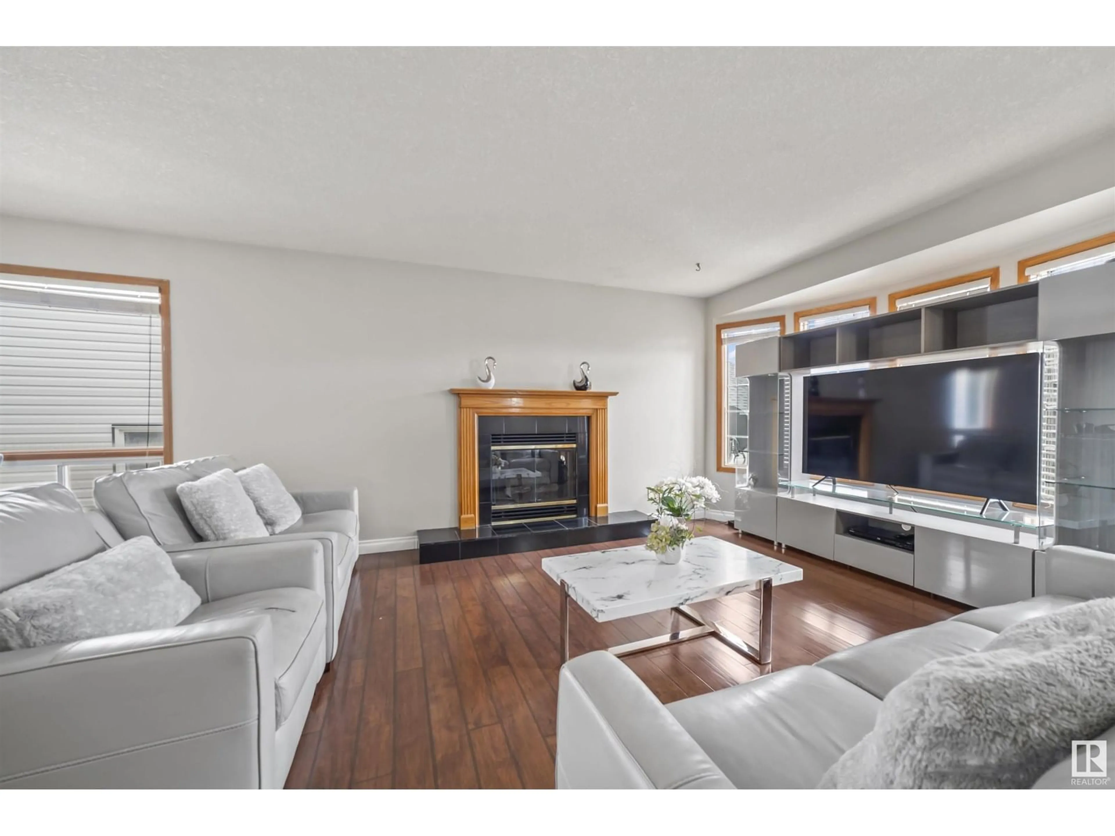 Living room with furniture, wood/laminate floor for 6210 162A AV, Edmonton Alberta T5Y2R2