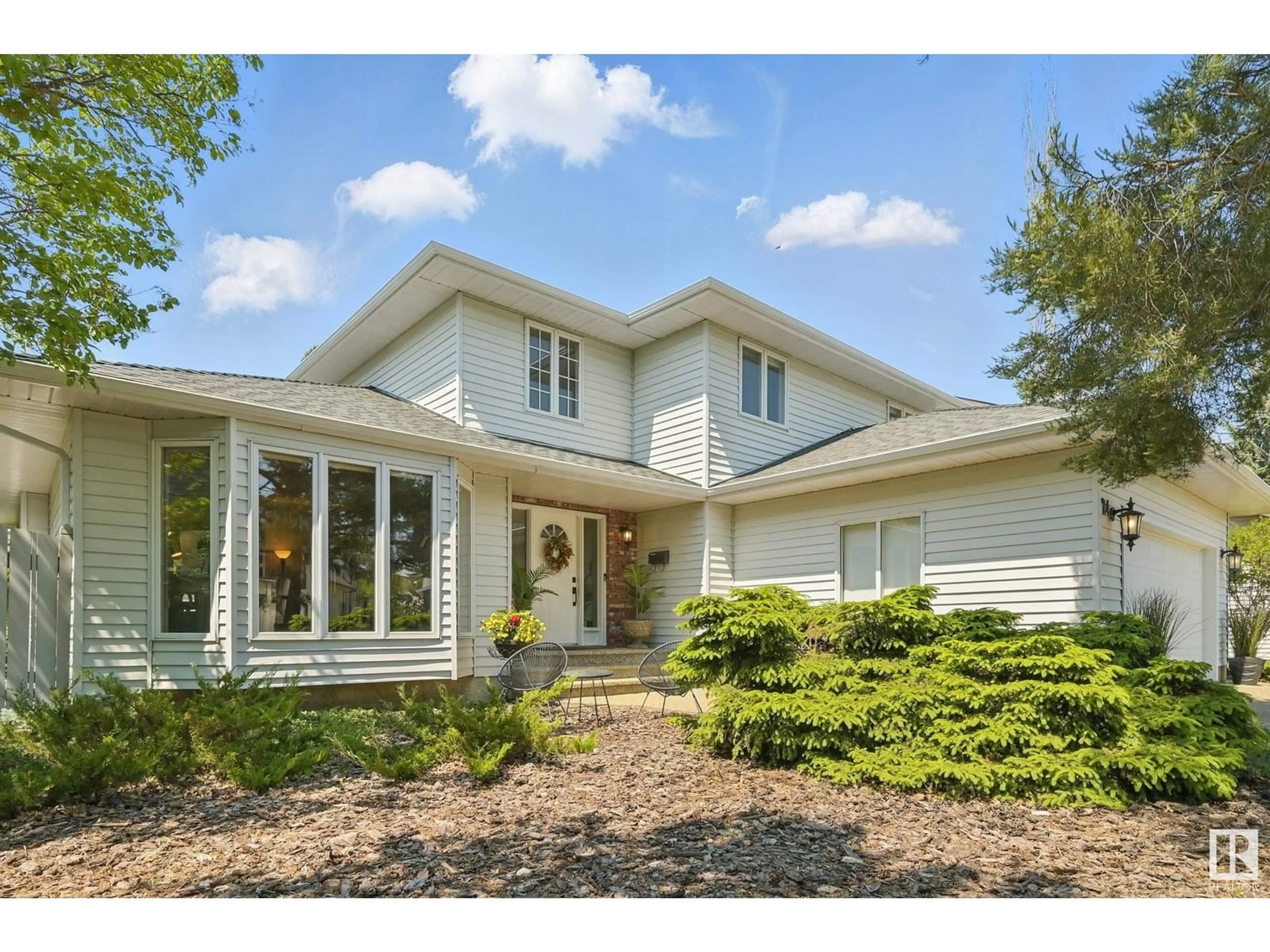 Home with vinyl exterior material, street for 24 BLUE QUILL CR, Edmonton Alberta T6J6C2
