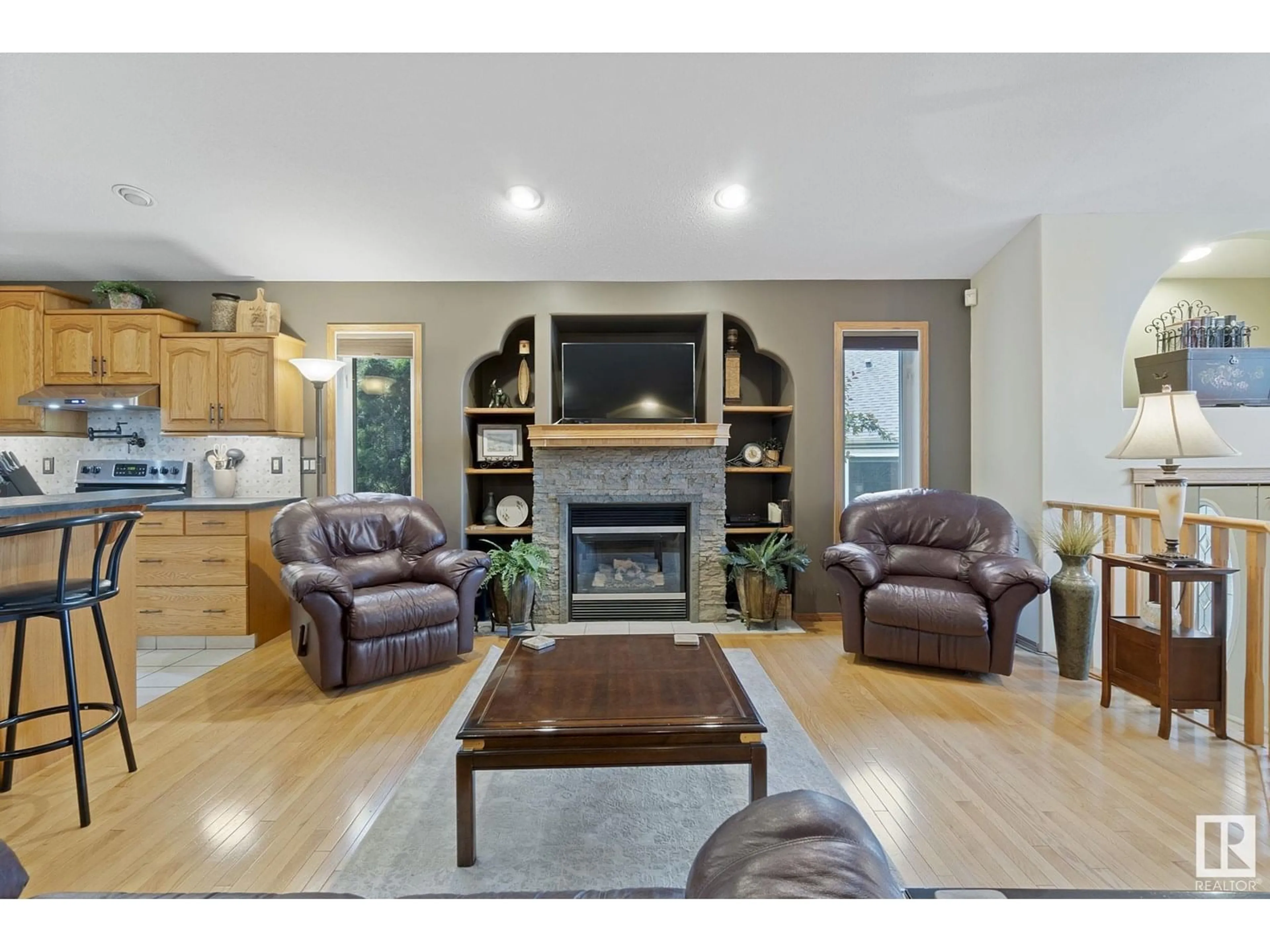 Living room with furniture, wood/laminate floor for 440 KANANASKIS CL, Devon Alberta T9G2C5